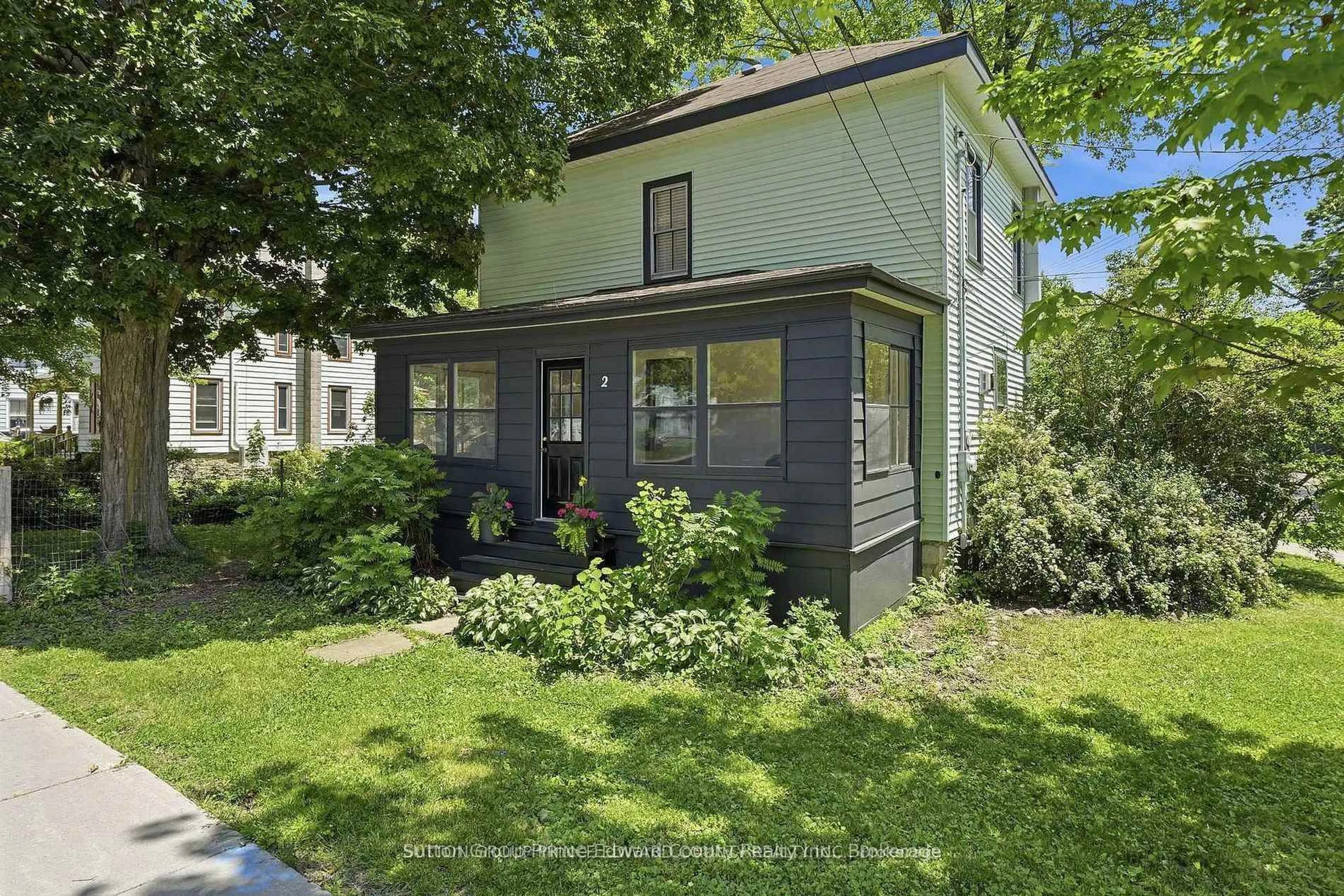 Home with vinyl exterior material, street for 2 Queen St, Prince Edward County Ontario K0K 2T0