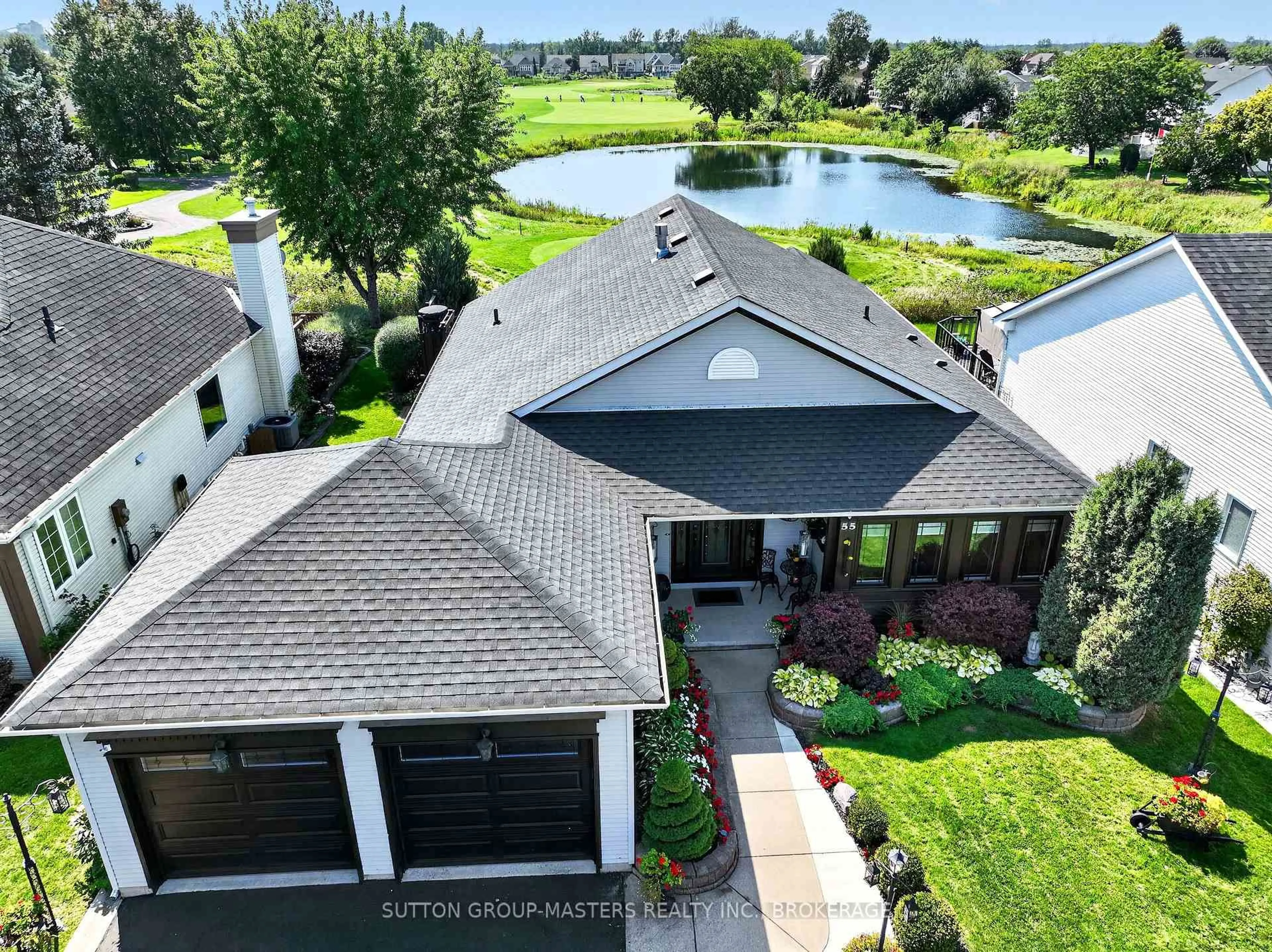 A pic from outside/outdoor area/front of a property/back of a property/a pic from drone, water/lake/river/ocean view for 55 Abbey Dawn Dr, Bath Ontario K0H 1G0