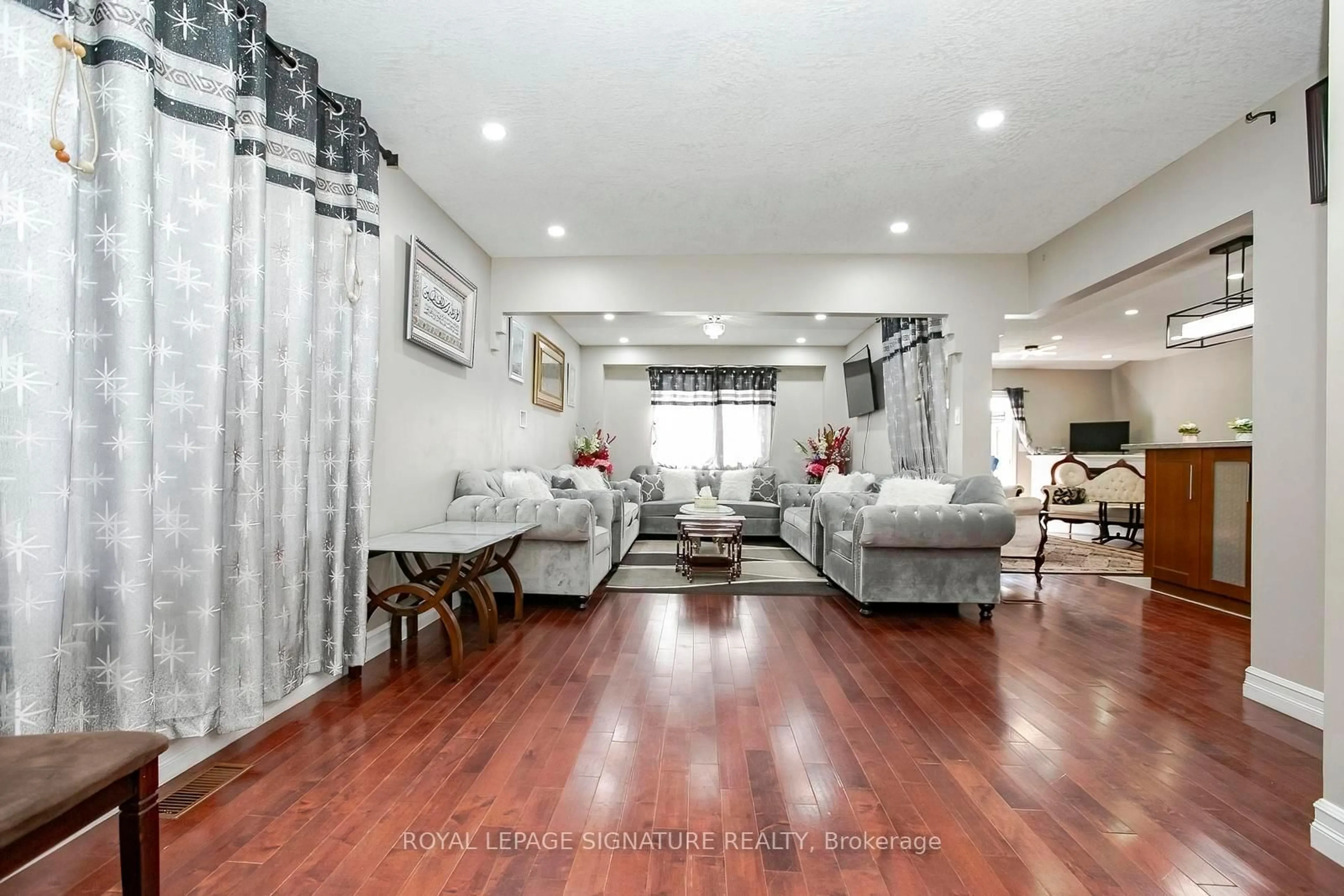 Living room with furniture, wood/laminate floor for 107 Glencliffe Crt, Kitchener Ontario N2B 3X1