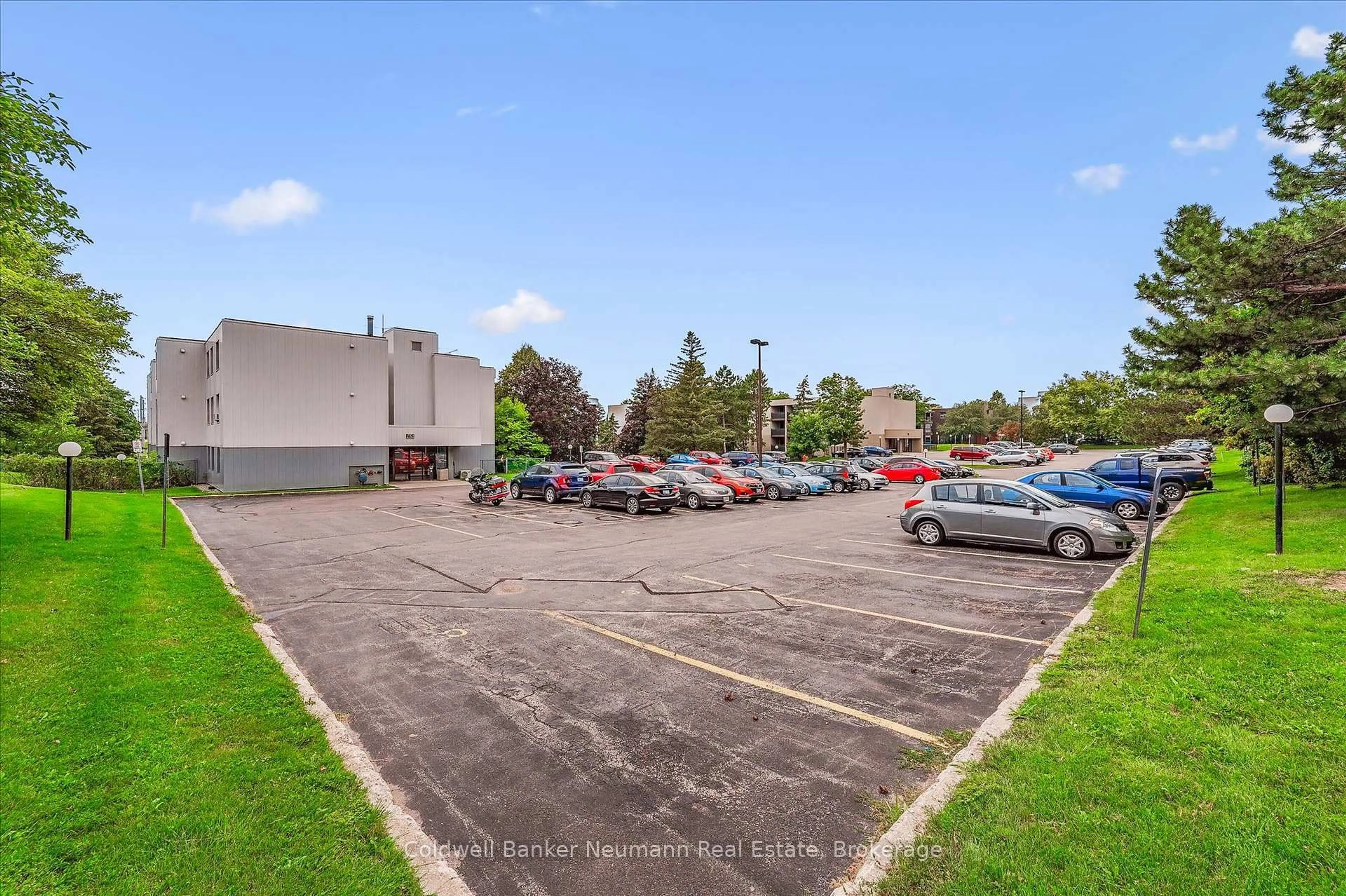 A pic from outside/outdoor area/front of a property/back of a property/a pic from drone, street for 65 Silvercreek Pkwy #407, Guelph Ontario N1H 7R9