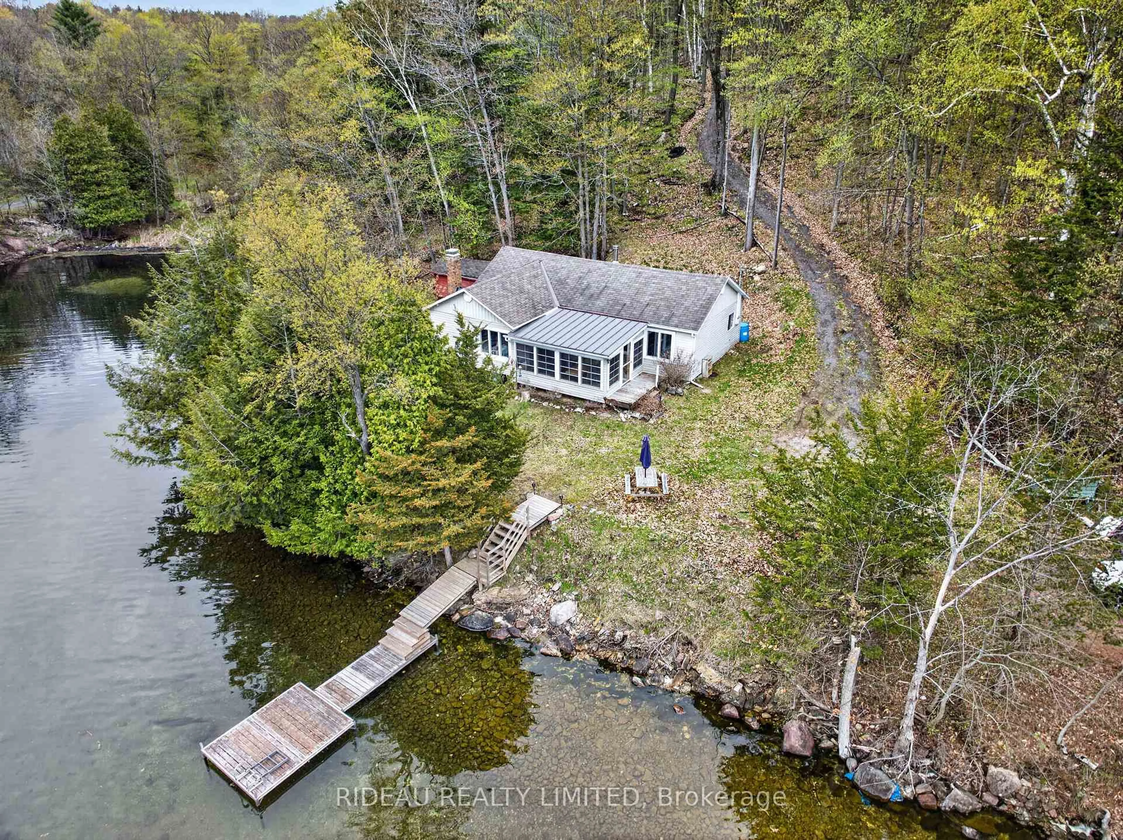 A pic from outside/outdoor area/front of a property/back of a property/a pic from drone, water/lake/river/ocean view for 9 Sparrow Lane, Rideau Lakes Ontario K0G 1V0