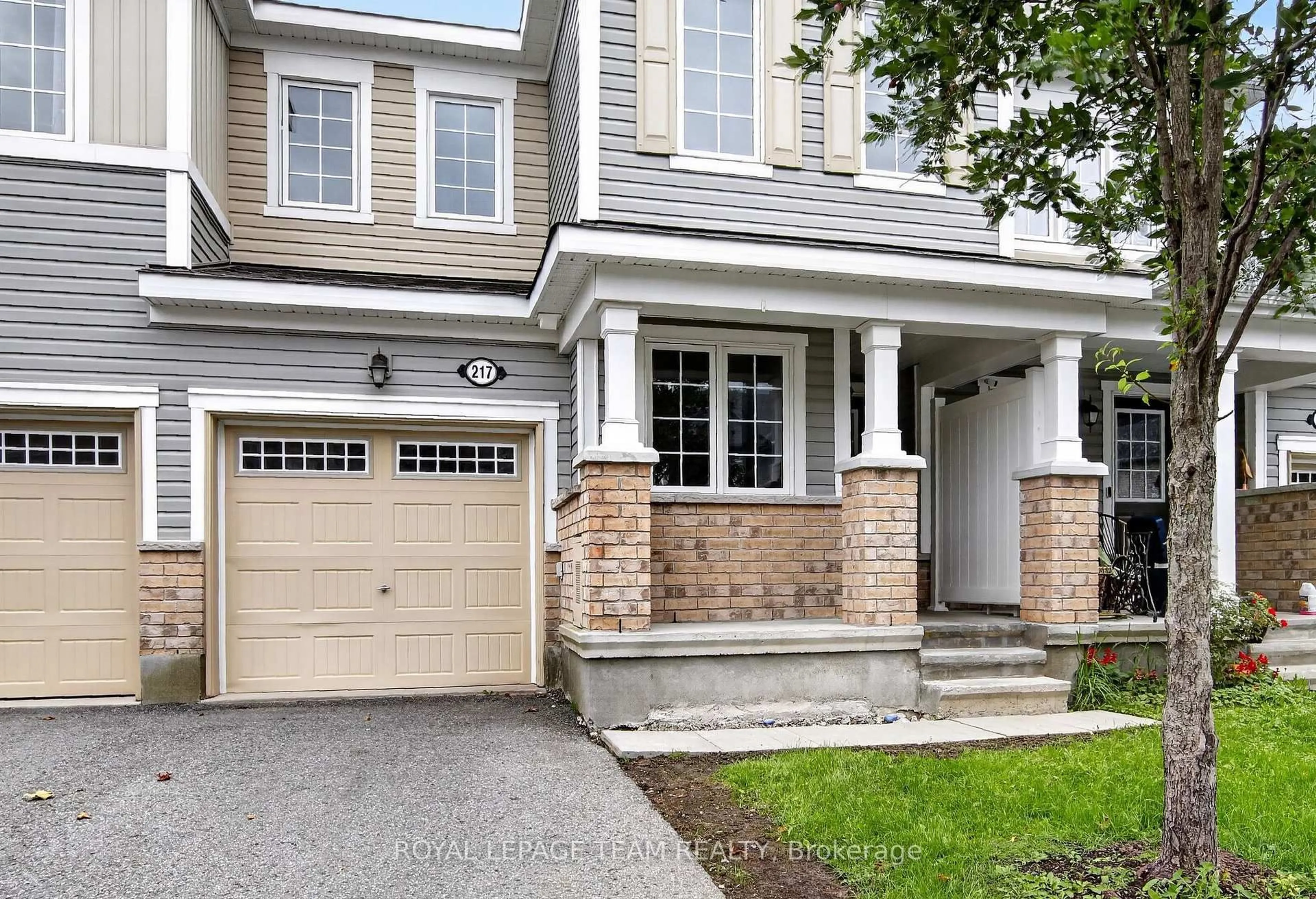 Home with brick exterior material, street for 217 Conifer Creek Circ, Ottawa Ontario K2M 0M2