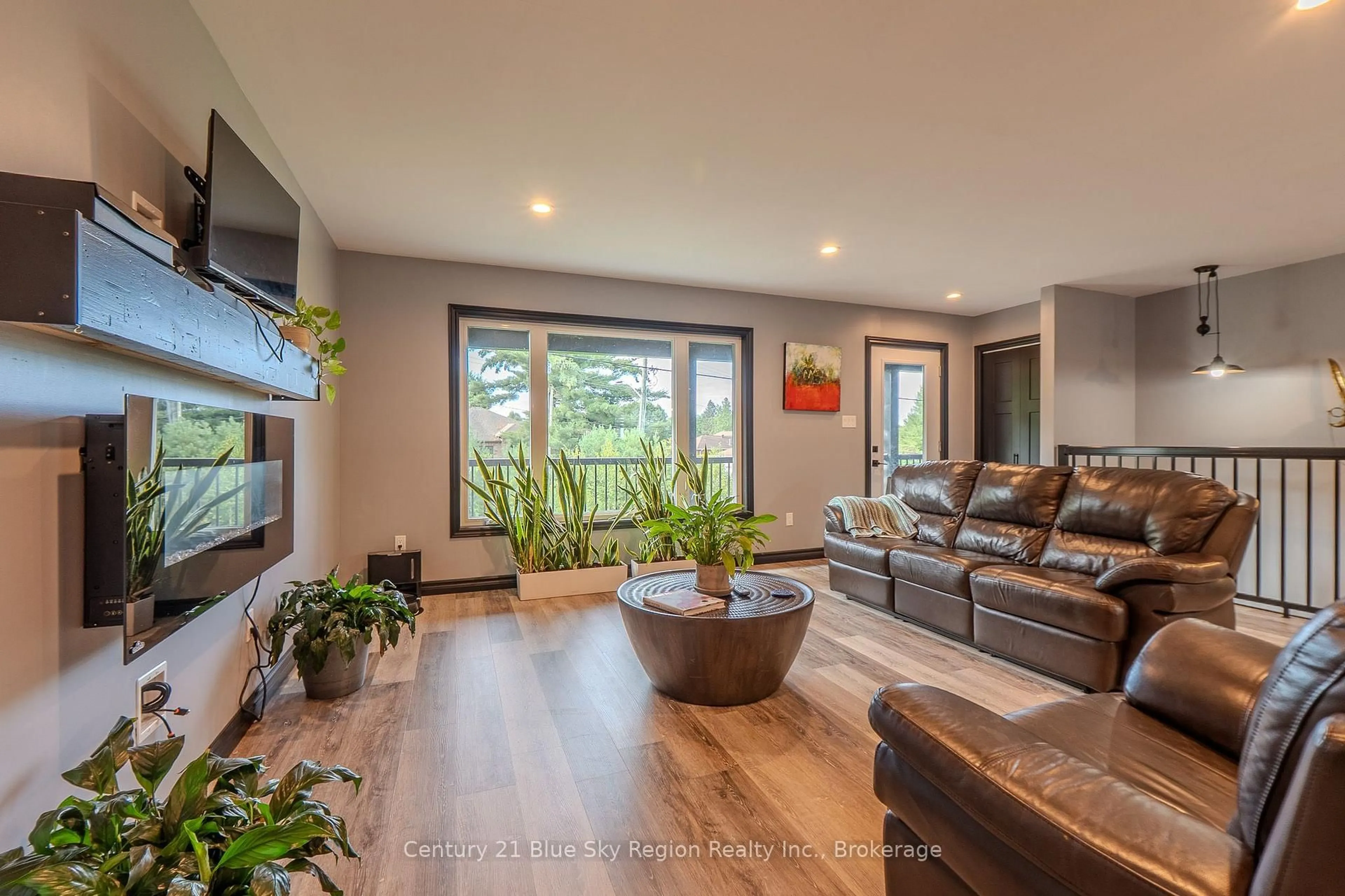 Living room with furniture, wood/laminate floor for 39 Tupper Dr, North Bay Ontario P1C 1N3