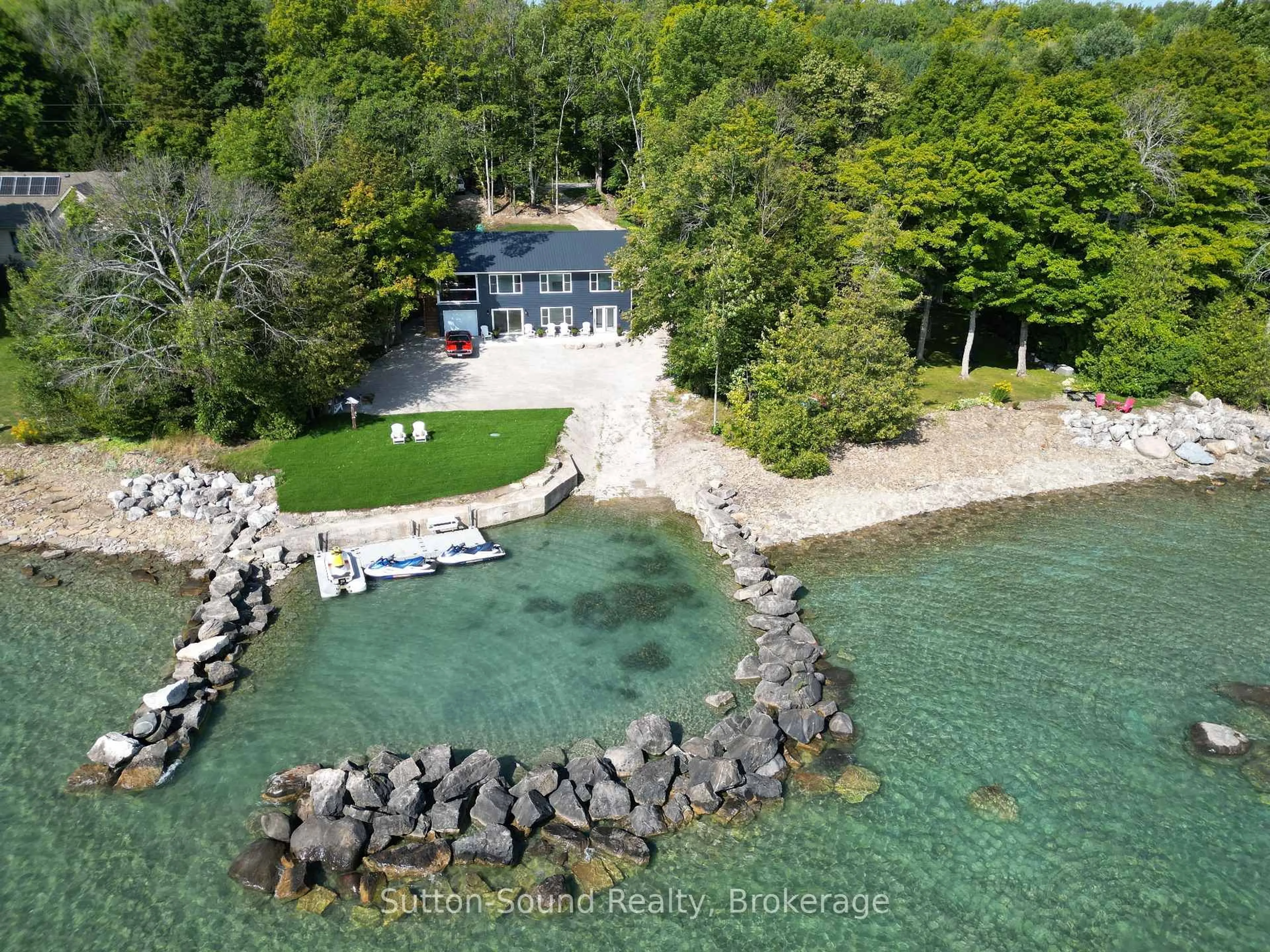 A pic from outside/outdoor area/front of a property/back of a property/a pic from drone, water/lake/river/ocean view for 504847 Grey Road 1 Rd, Georgian Bluffs Ontario N4K 5N4