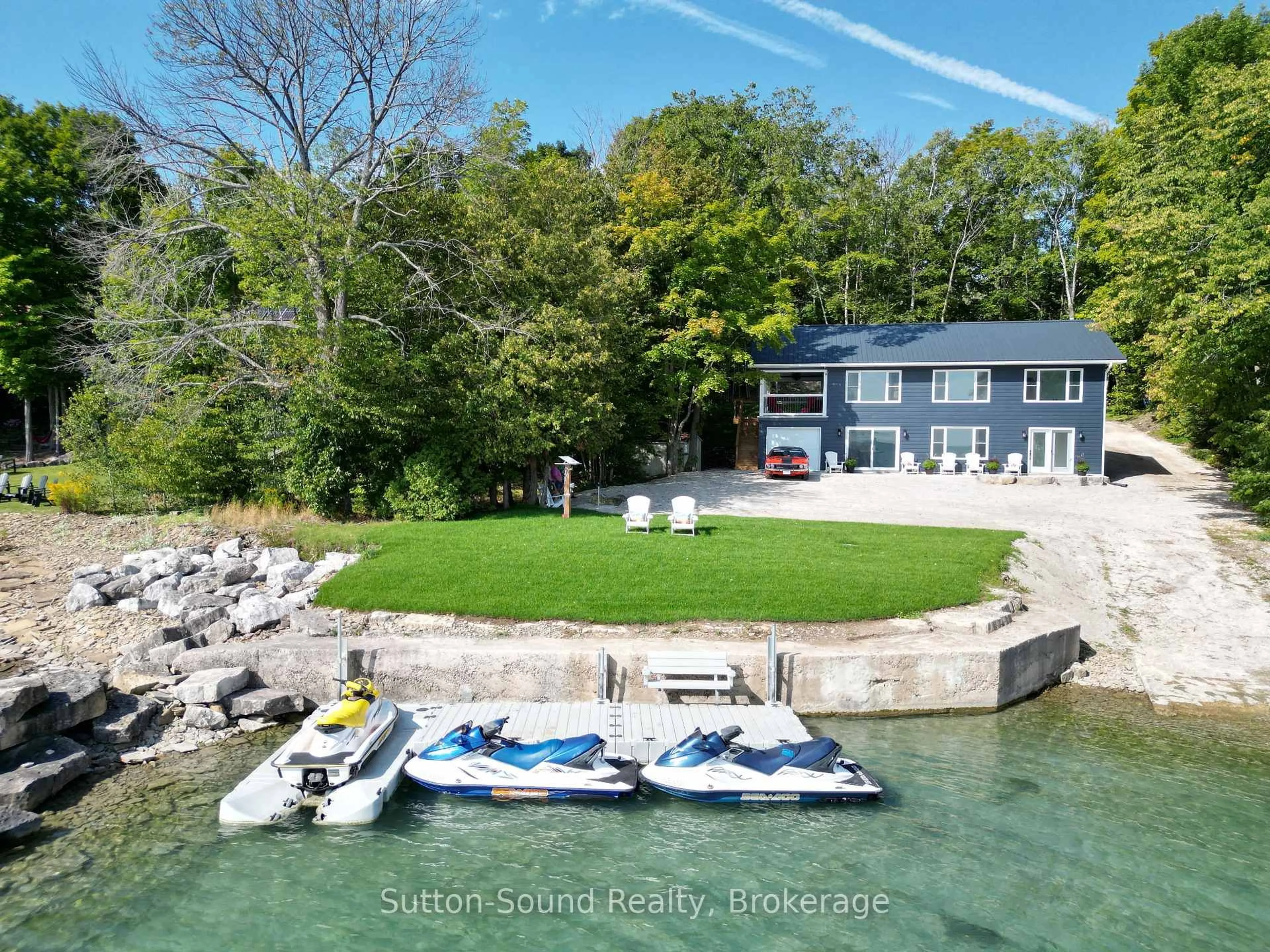 A pic from outside/outdoor area/front of a property/back of a property/a pic from drone, water/lake/river/ocean view for 504847 Grey Road 1 Rd, Georgian Bluffs Ontario N4K 5N4