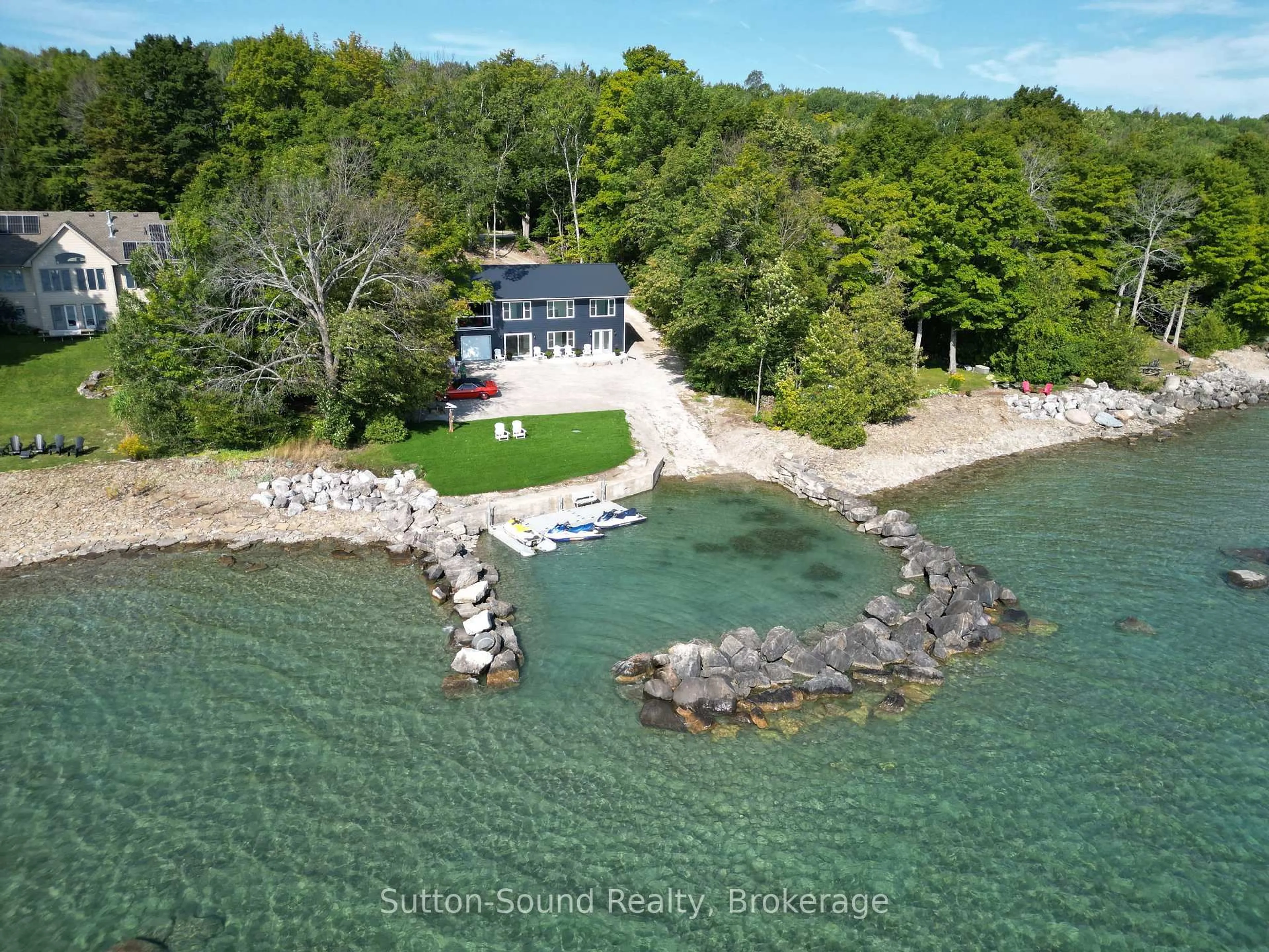 A pic from outside/outdoor area/front of a property/back of a property/a pic from drone, water/lake/river/ocean view for 504847 Grey Road 1 Rd, Georgian Bluffs Ontario N4K 5N4