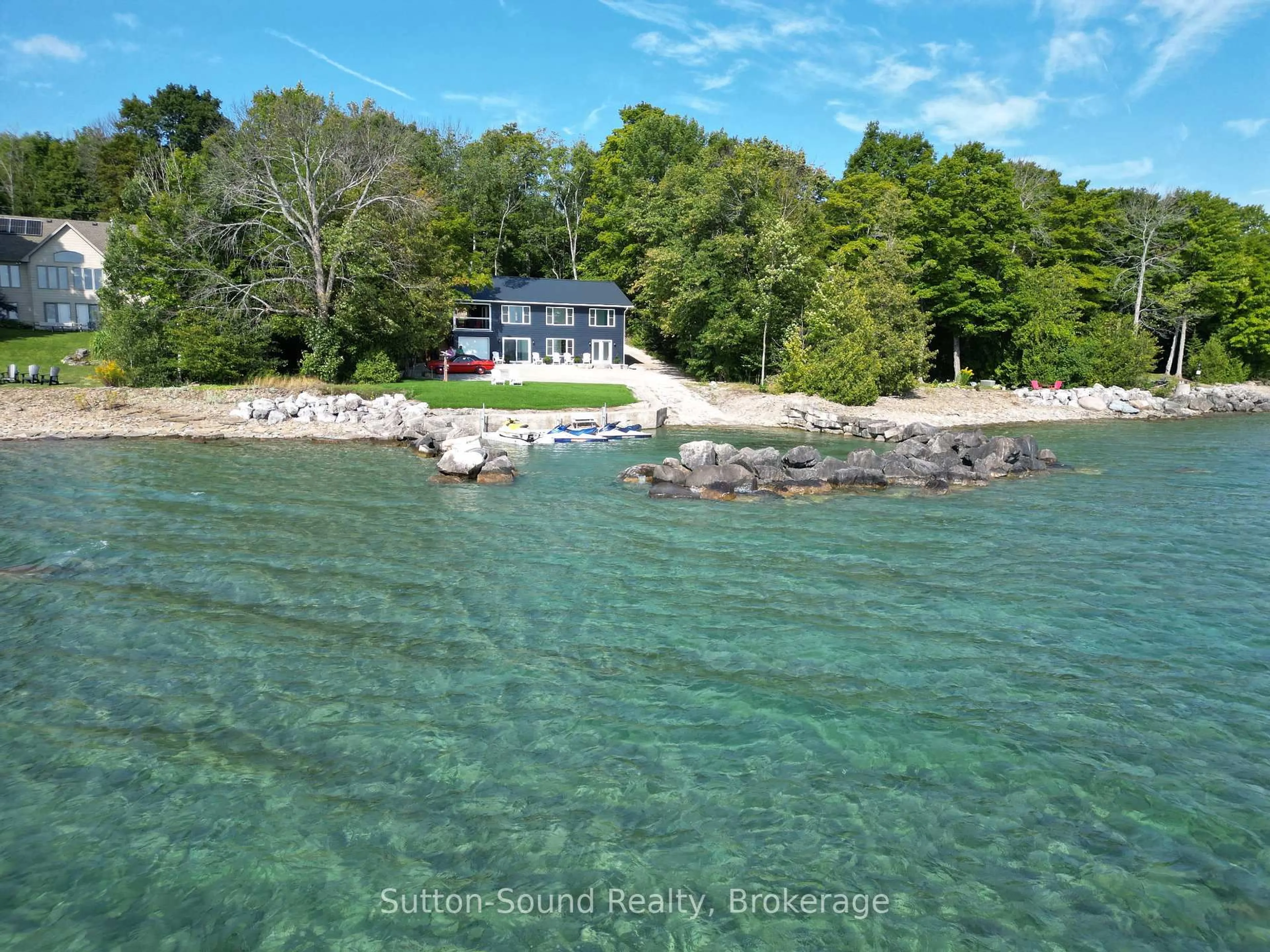 A pic from outside/outdoor area/front of a property/back of a property/a pic from drone, water/lake/river/ocean view for 504847 Grey Road 1 Rd, Georgian Bluffs Ontario N4K 5N4