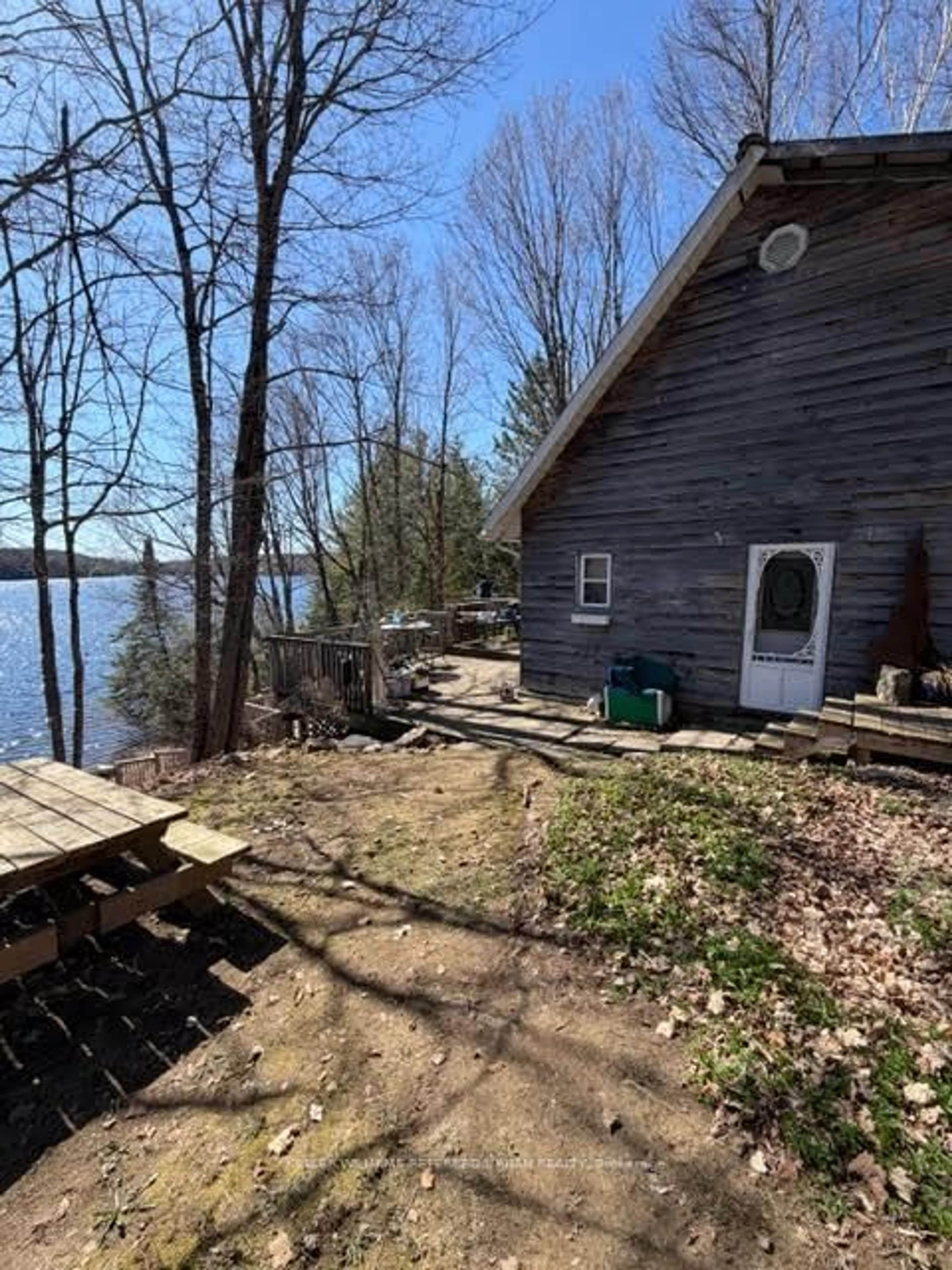 A pic from outside/outdoor area/front of a property/back of a property/a pic from drone, water/lake/river/ocean view for 1507 Old Folks Dr, Highlands East Ontario K0L 2Y0