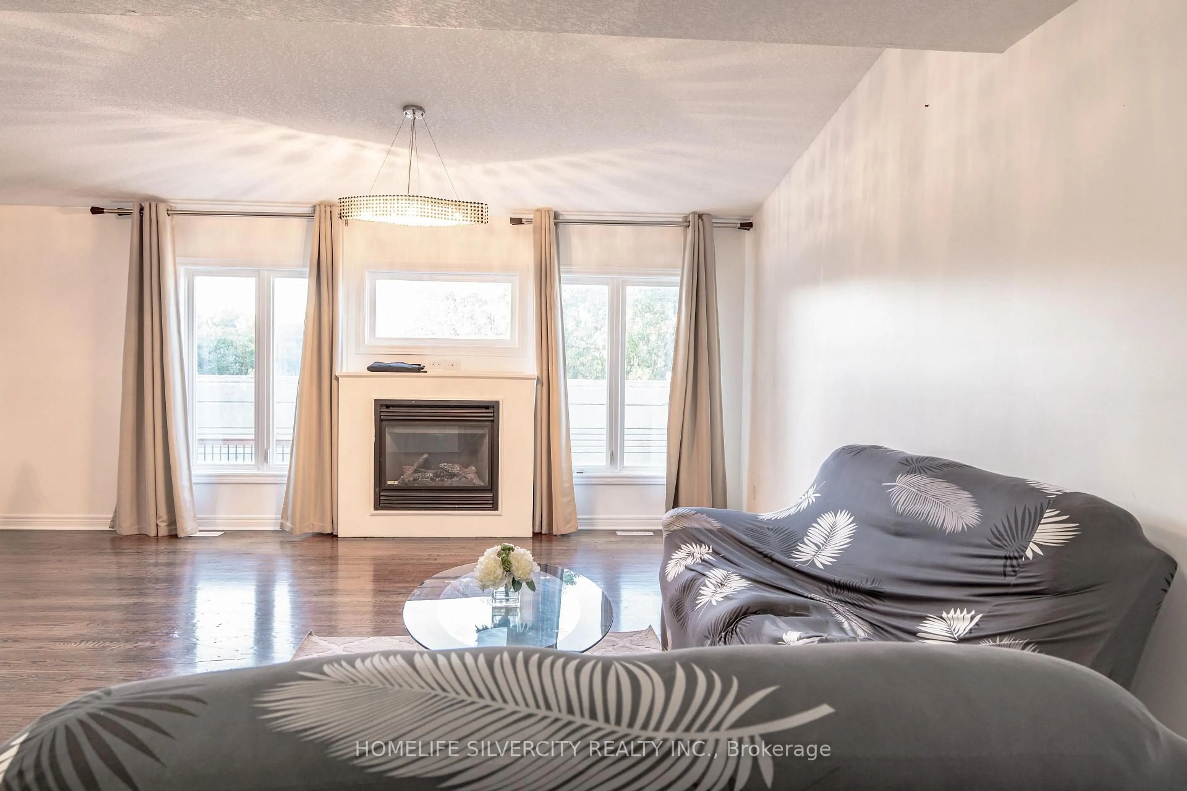 Living room with furniture, wood/laminate floor for 685 North Leaksdale Circ, London South Ontario N6M 1M1