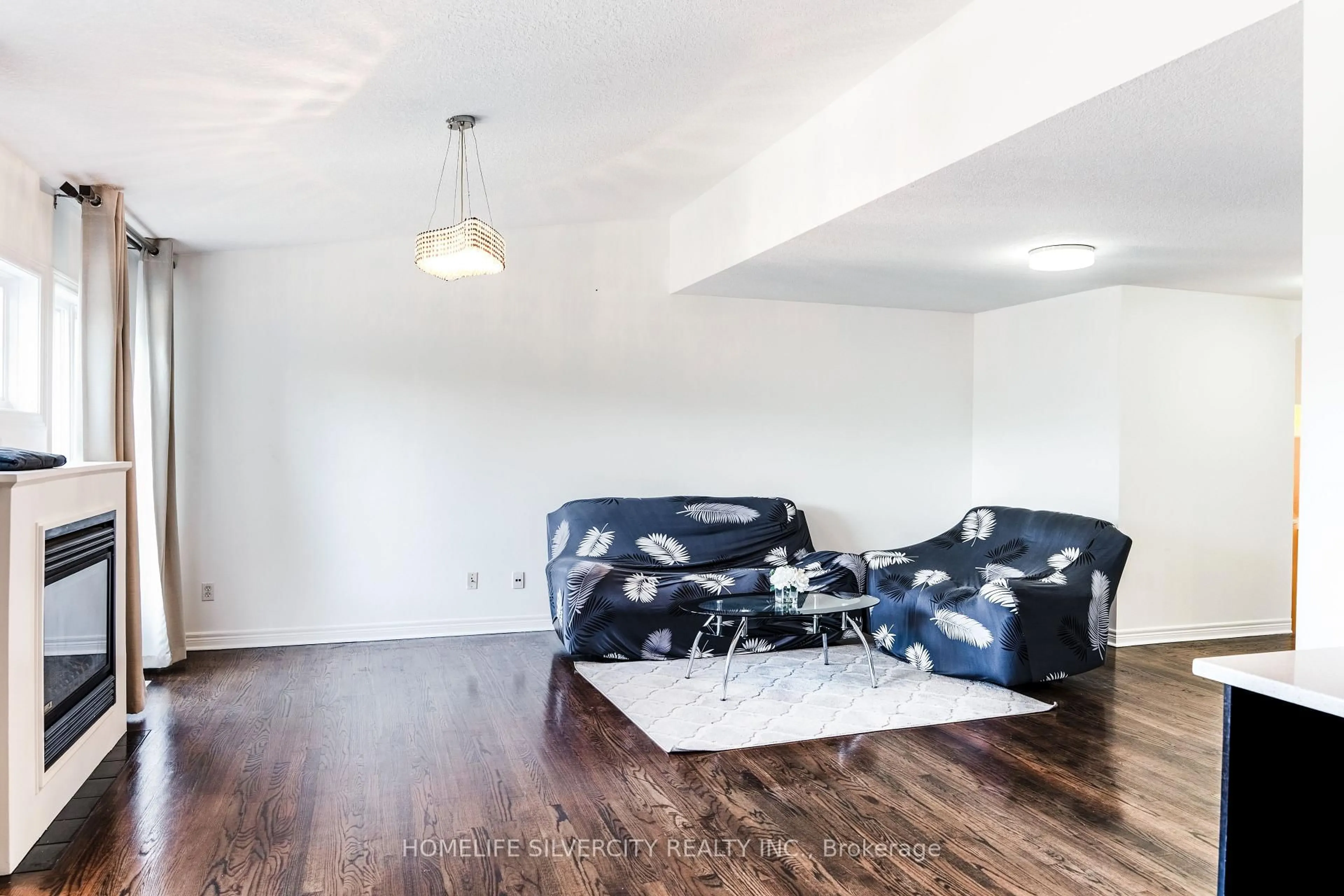 Living room with furniture, wood/laminate floor for 685 North Leaksdale Circ, London South Ontario N6M 1M1