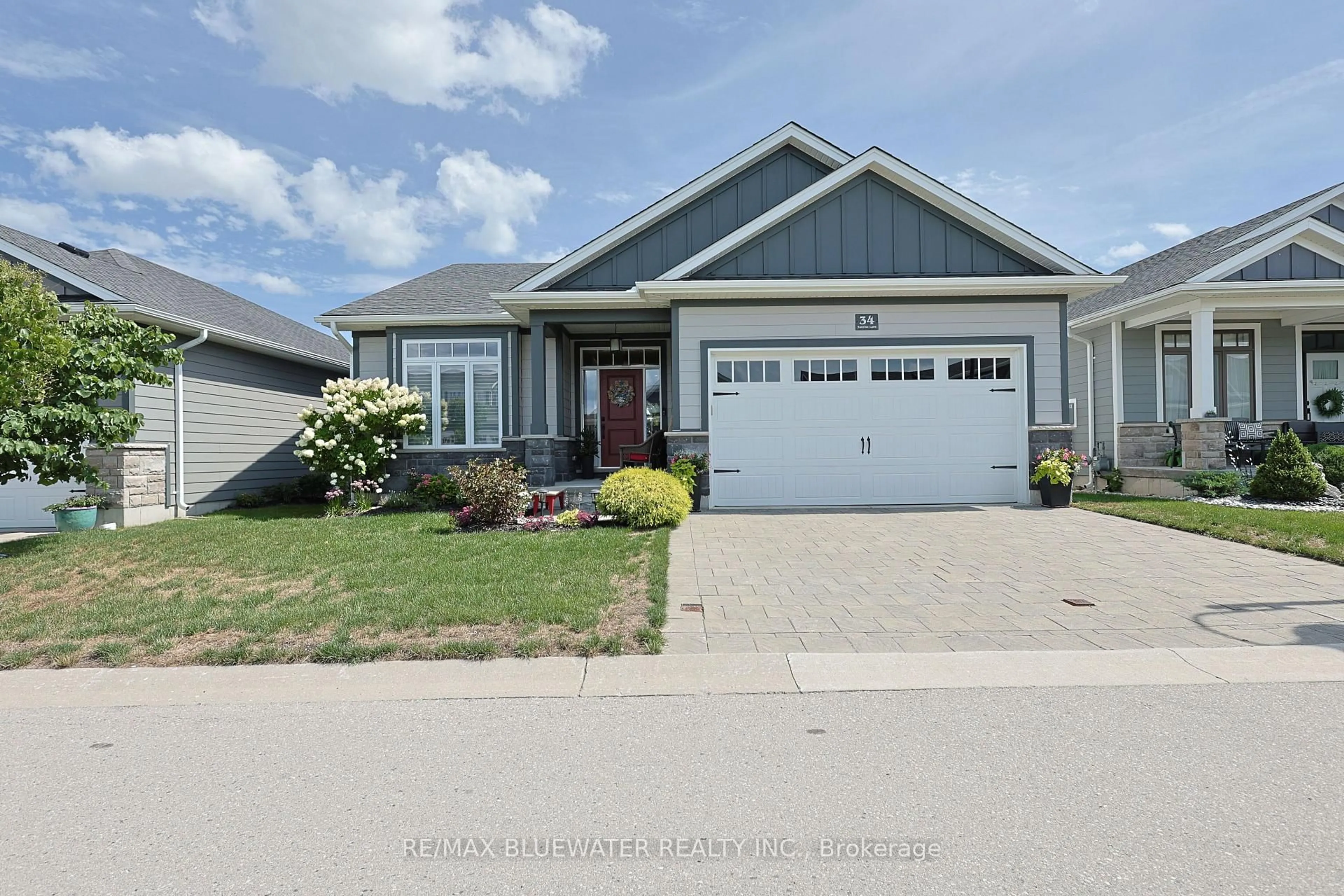 Home with vinyl exterior material, street for 34 Sunrise Lane, Lambton Shores Ontario N0M 1T0