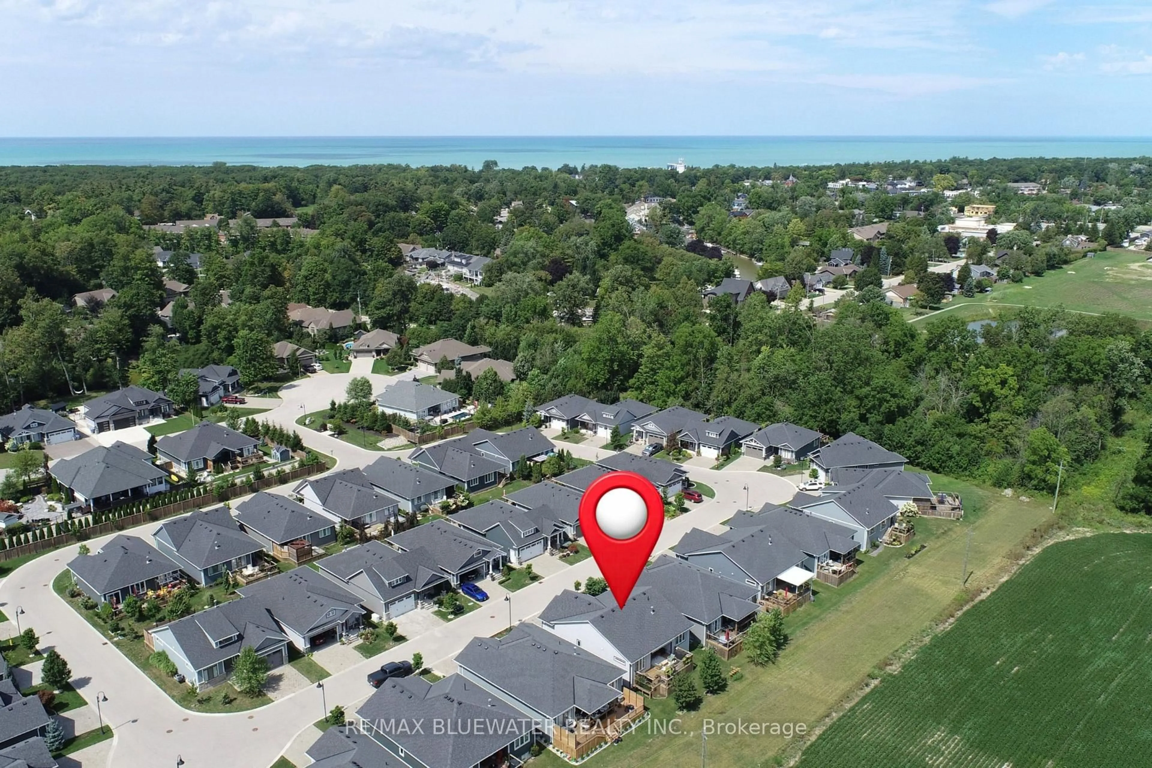 A pic from outside/outdoor area/front of a property/back of a property/a pic from drone, water/lake/river/ocean view for 34 Sunrise Lane, Lambton Shores Ontario N0M 1T0