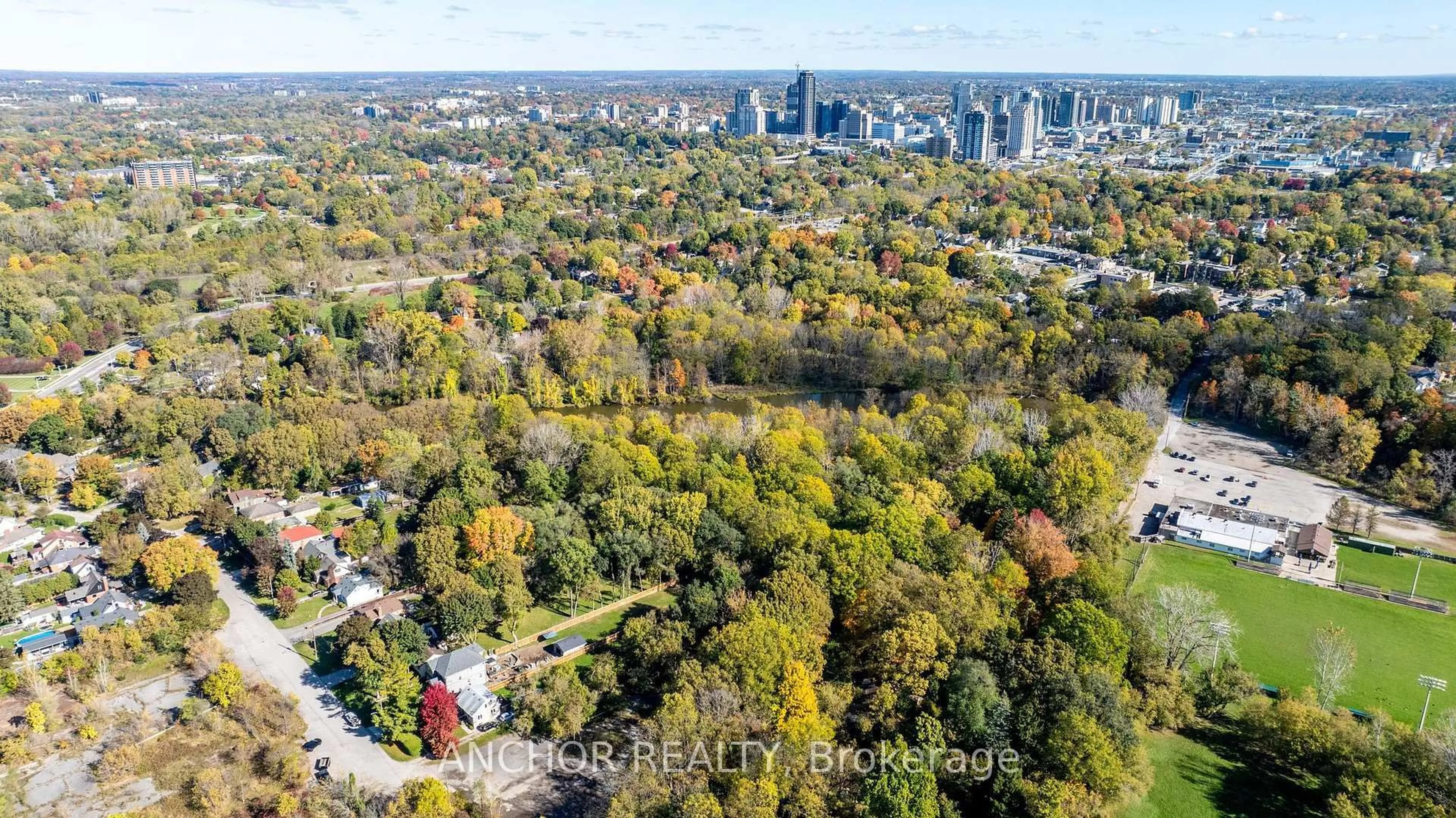 A pic from outside/outdoor area/front of a property/back of a property/a pic from drone, forest/trees view for 65 Cove Rd, London South Ontario N6J 1H8