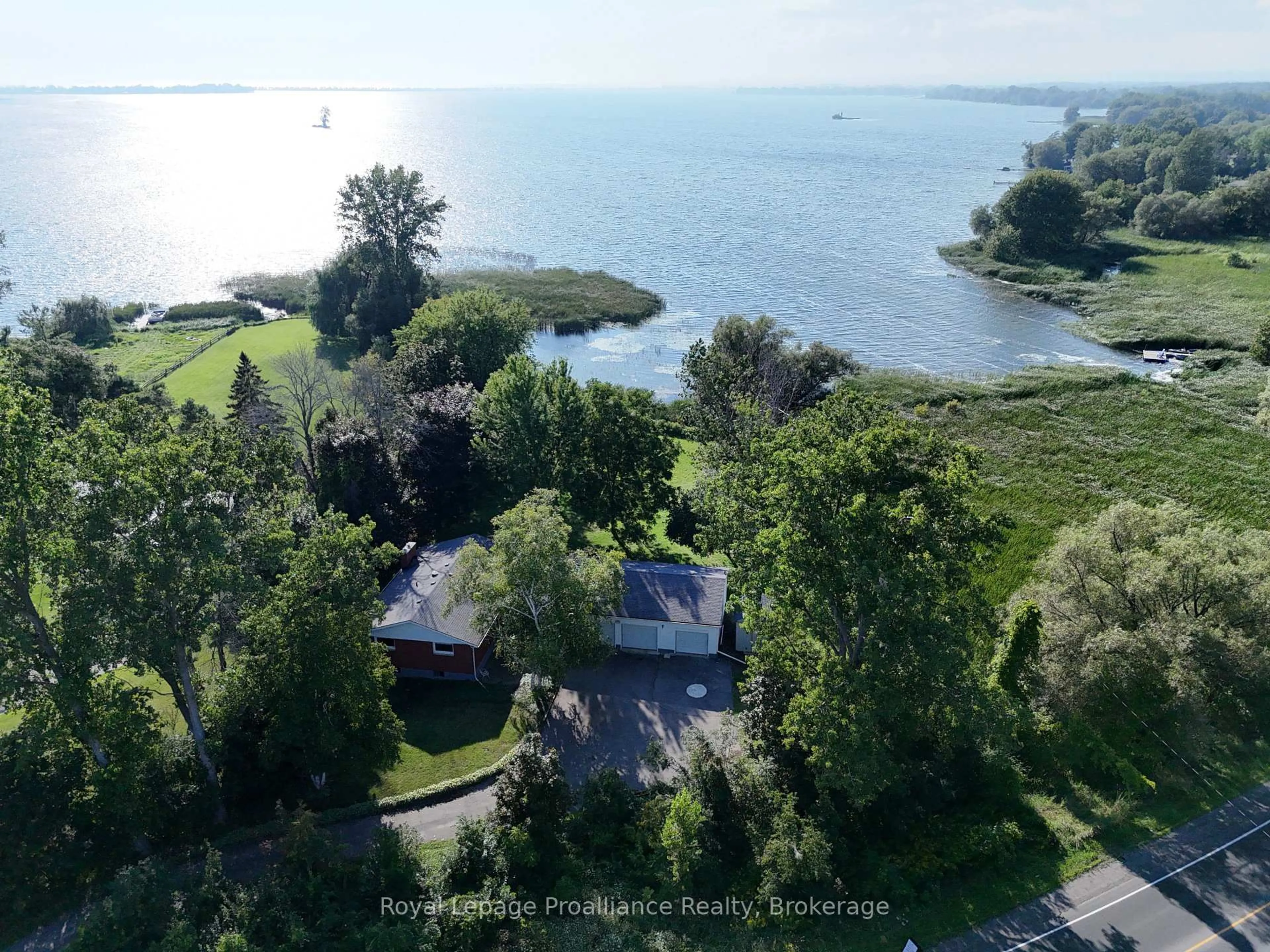 A pic from outside/outdoor area/front of a property/back of a property/a pic from drone, water/lake/river/ocean view for 311E County Rd 29 Rd, Prince Edward County Ontario K0K 1T0