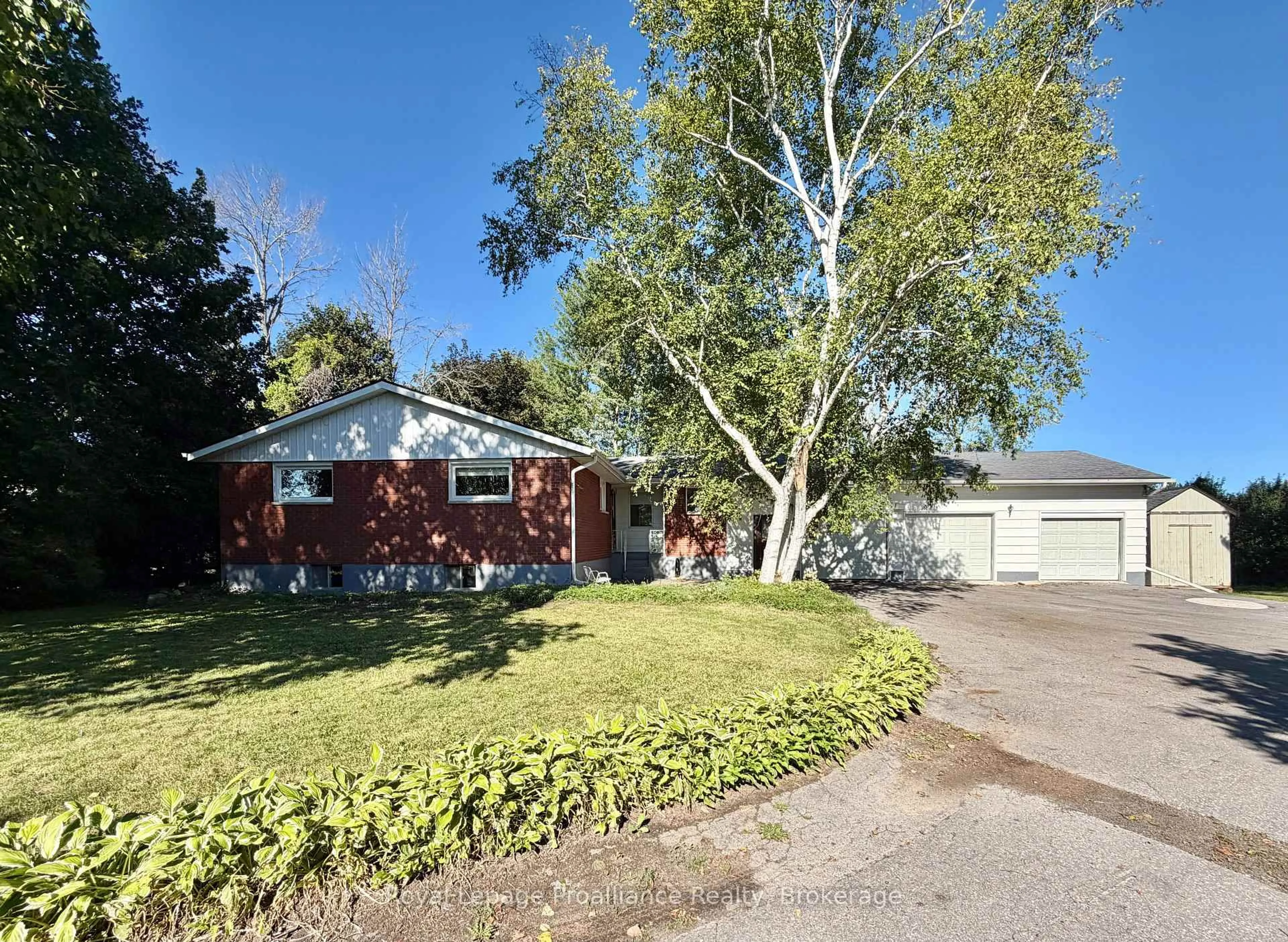 A pic from outside/outdoor area/front of a property/back of a property/a pic from drone, street for 311E County Rd 29 Rd, Prince Edward County Ontario K0K 1T0