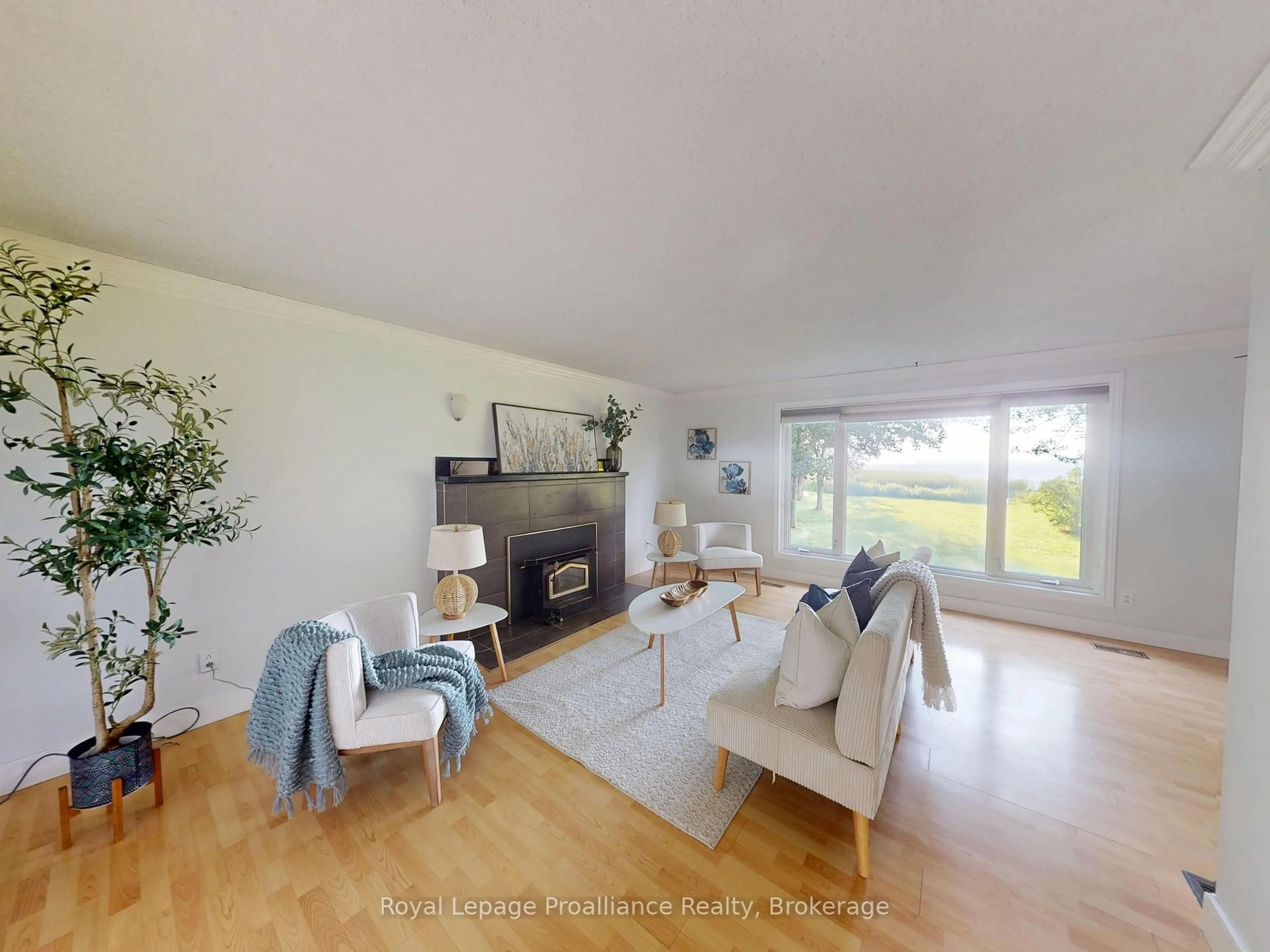 Living room with furniture, wood/laminate floor for 311E County Rd 29 Rd, Prince Edward County Ontario K0K 1T0