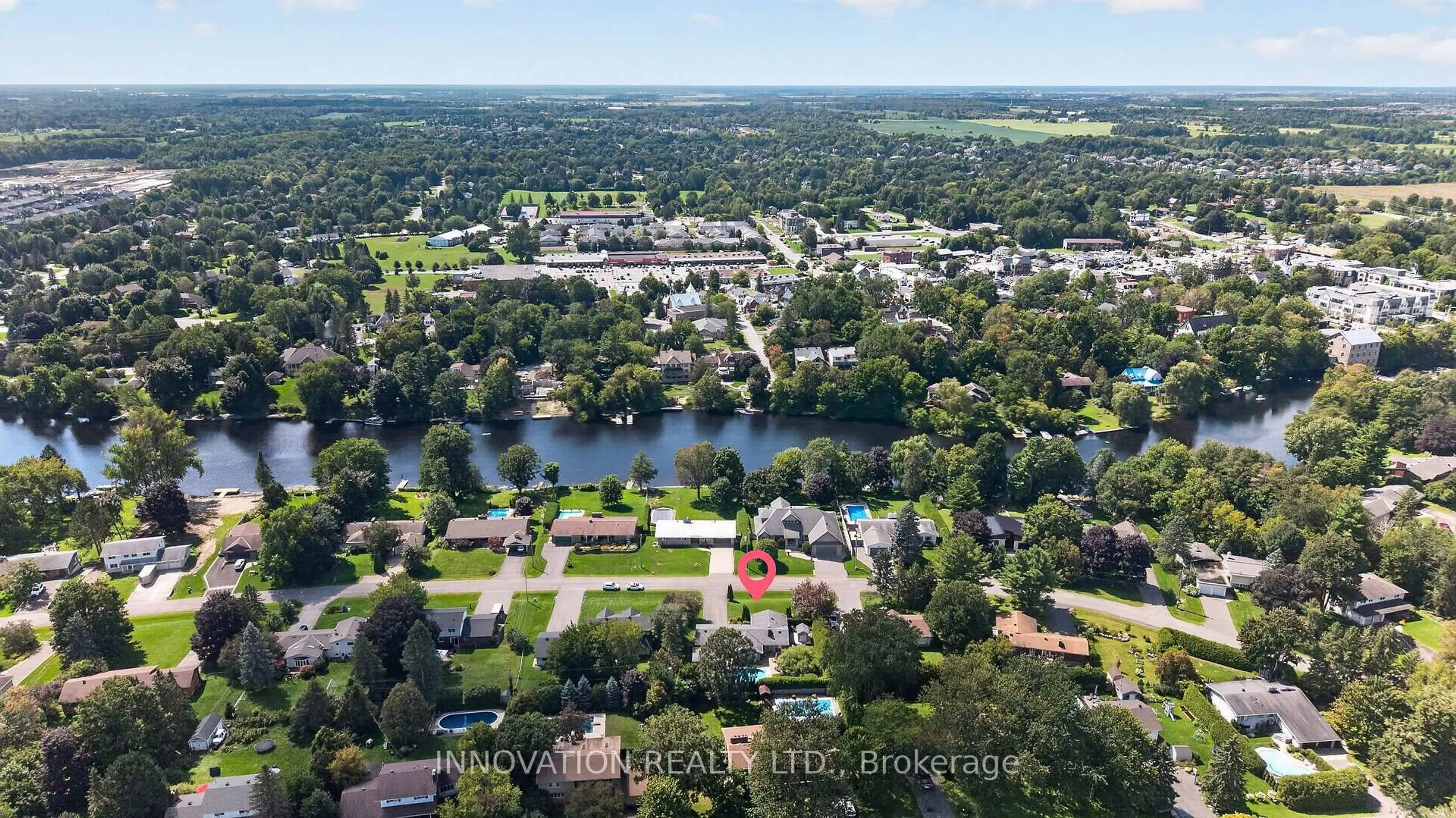 A pic from outside/outdoor area/front of a property/back of a property/a pic from drone, water/lake/river/ocean view for 5569 South River Dr, Manotick Ontario K4M 1J4