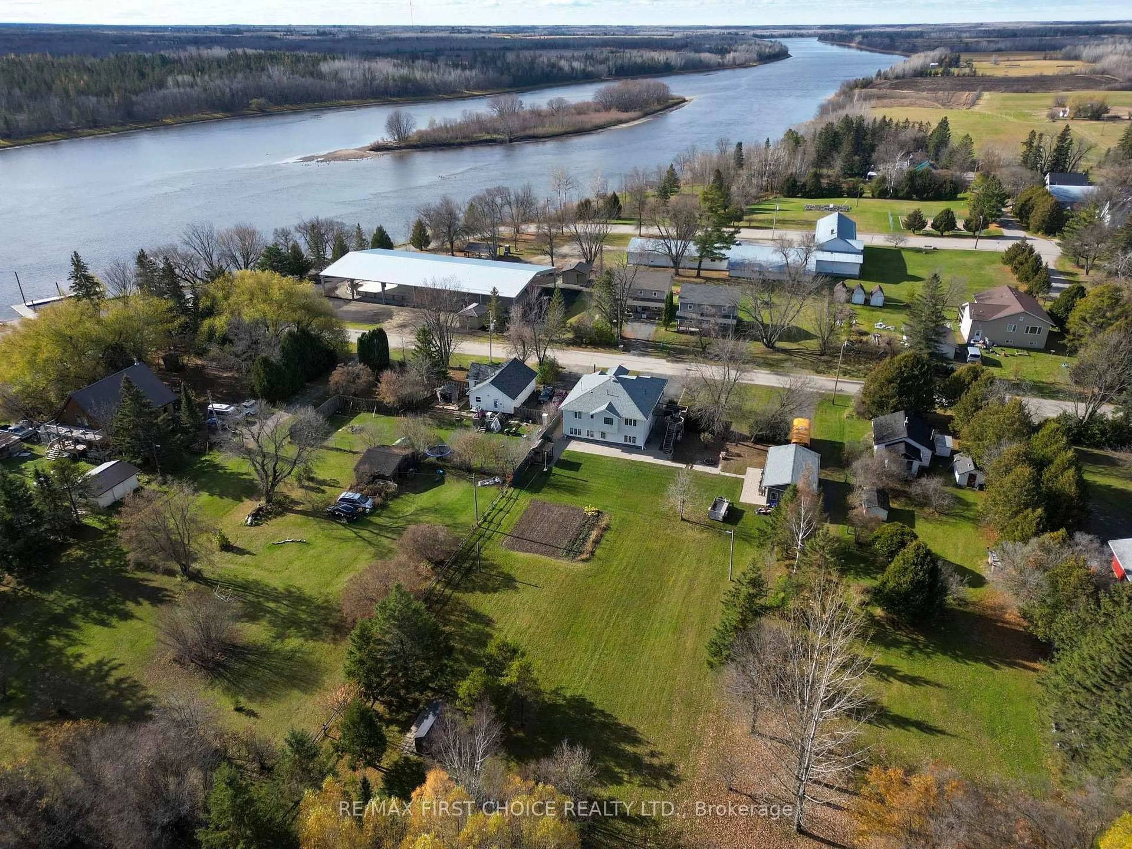 A pic from outside/outdoor area/front of a property/back of a property/a pic from drone, water/lake/river/ocean view for 100 Queen St, Chapple Ontario P0W 1A0