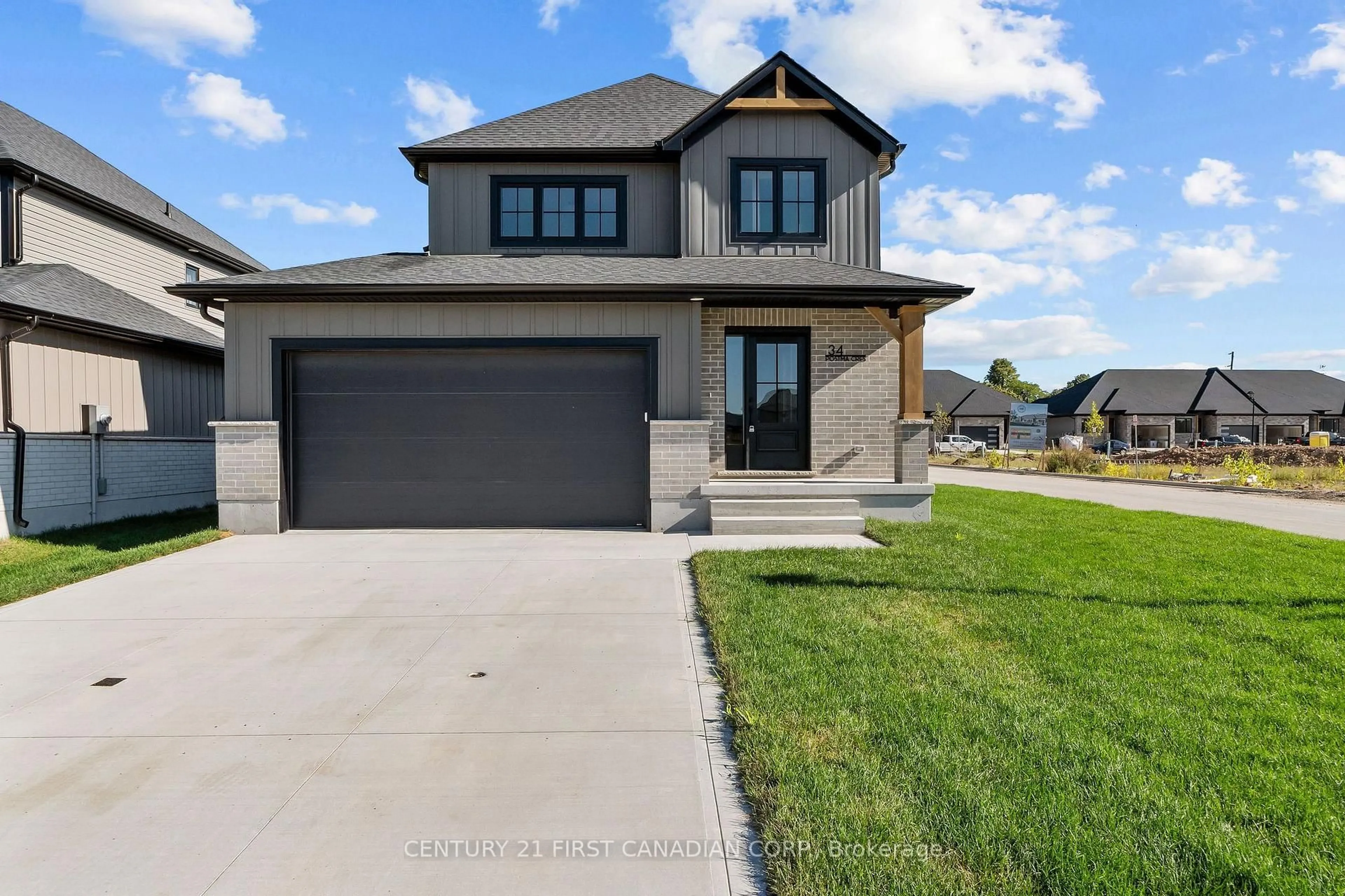 Home with brick exterior material, street for 34 Postma Cres, North Middlesex Ontario N0M 1A0