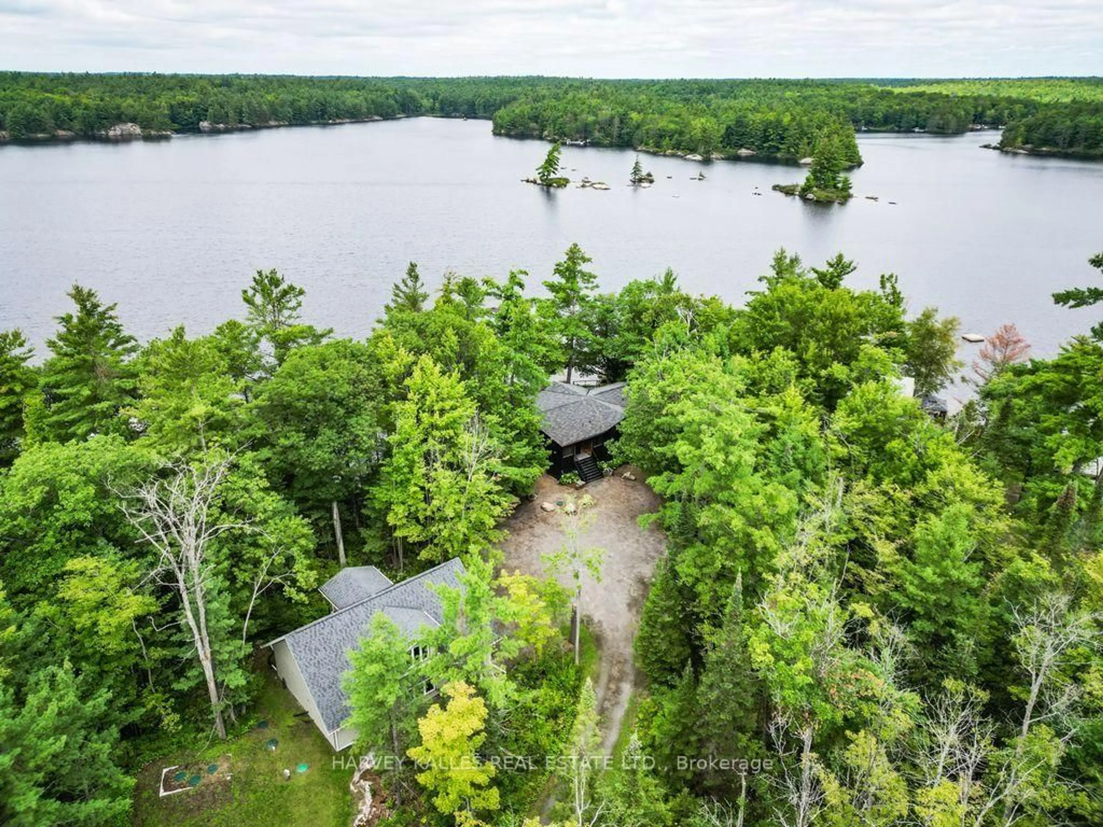 A pic from outside/outdoor area/front of a property/back of a property/a pic from drone, water/lake/river/ocean view for 1069 White Eagle Rd, Gravenhurst Ontario P0E 1G0