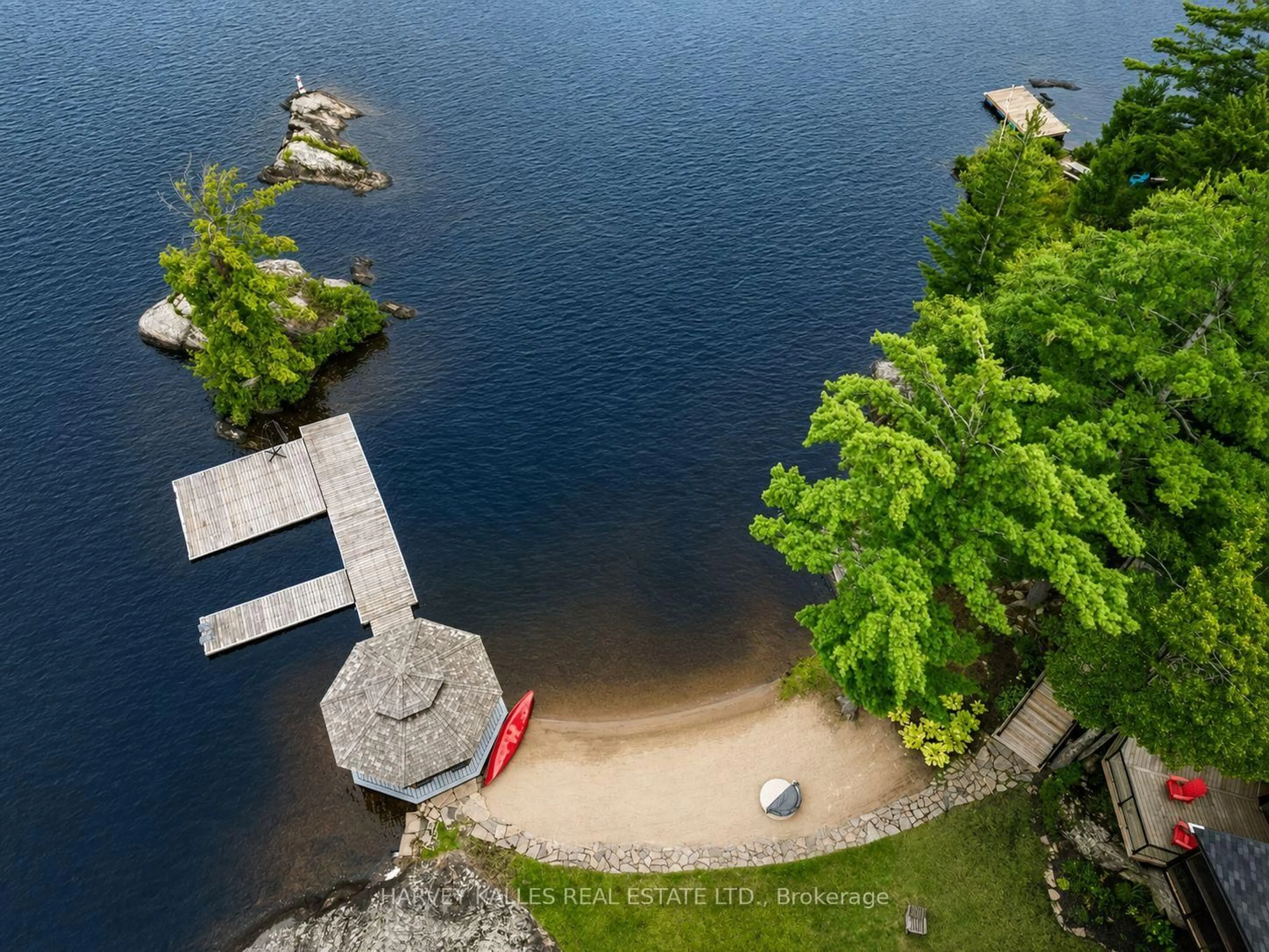 A pic from outside/outdoor area/front of a property/back of a property/a pic from drone, water/lake/river/ocean view for 1069 White Eagle Rd, Gravenhurst Ontario P0E 1G0