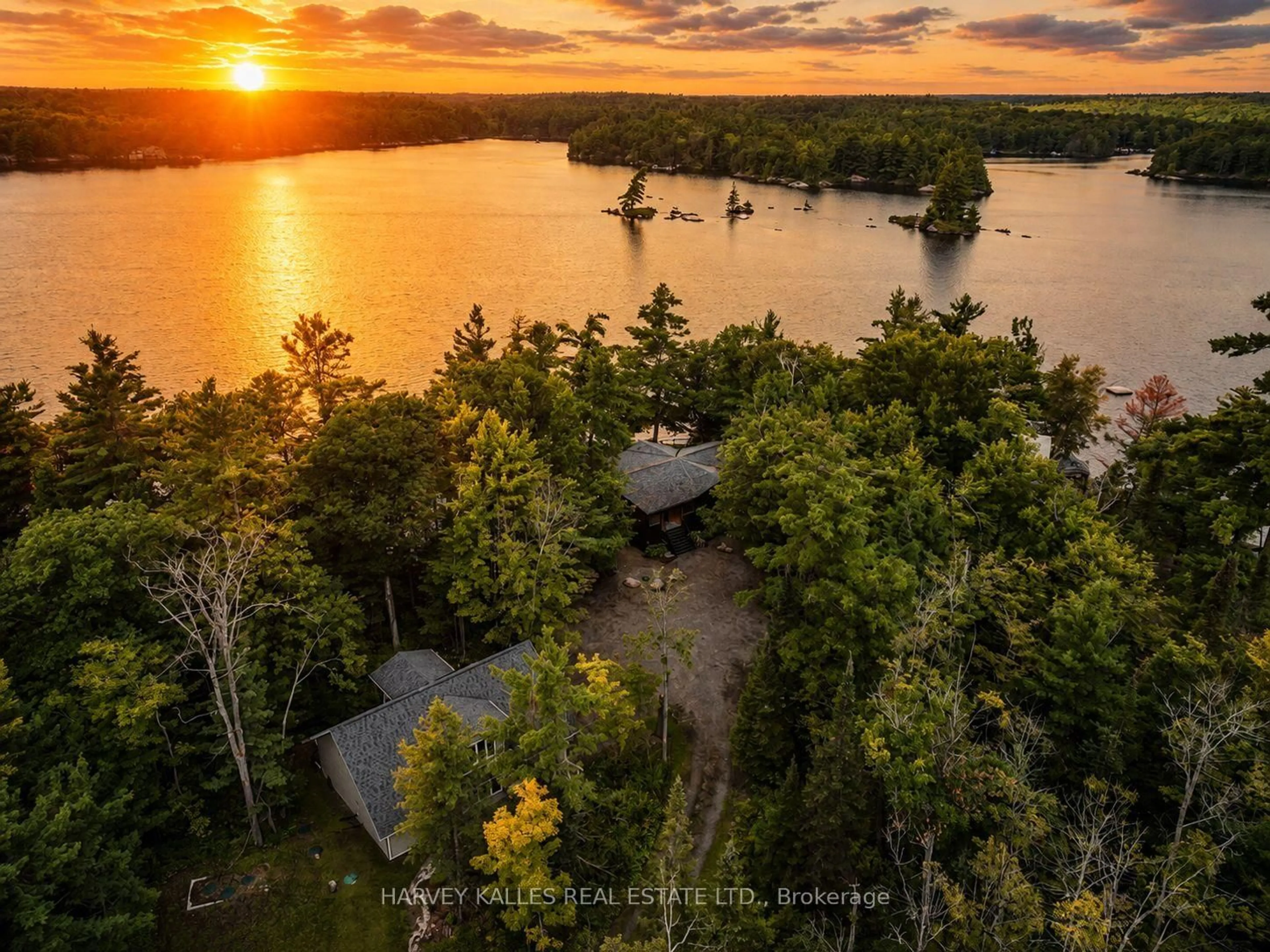 A pic from outside/outdoor area/front of a property/back of a property/a pic from drone, water/lake/river/ocean view for 1069 White Eagle Rd, Gravenhurst Ontario P0E 1G0