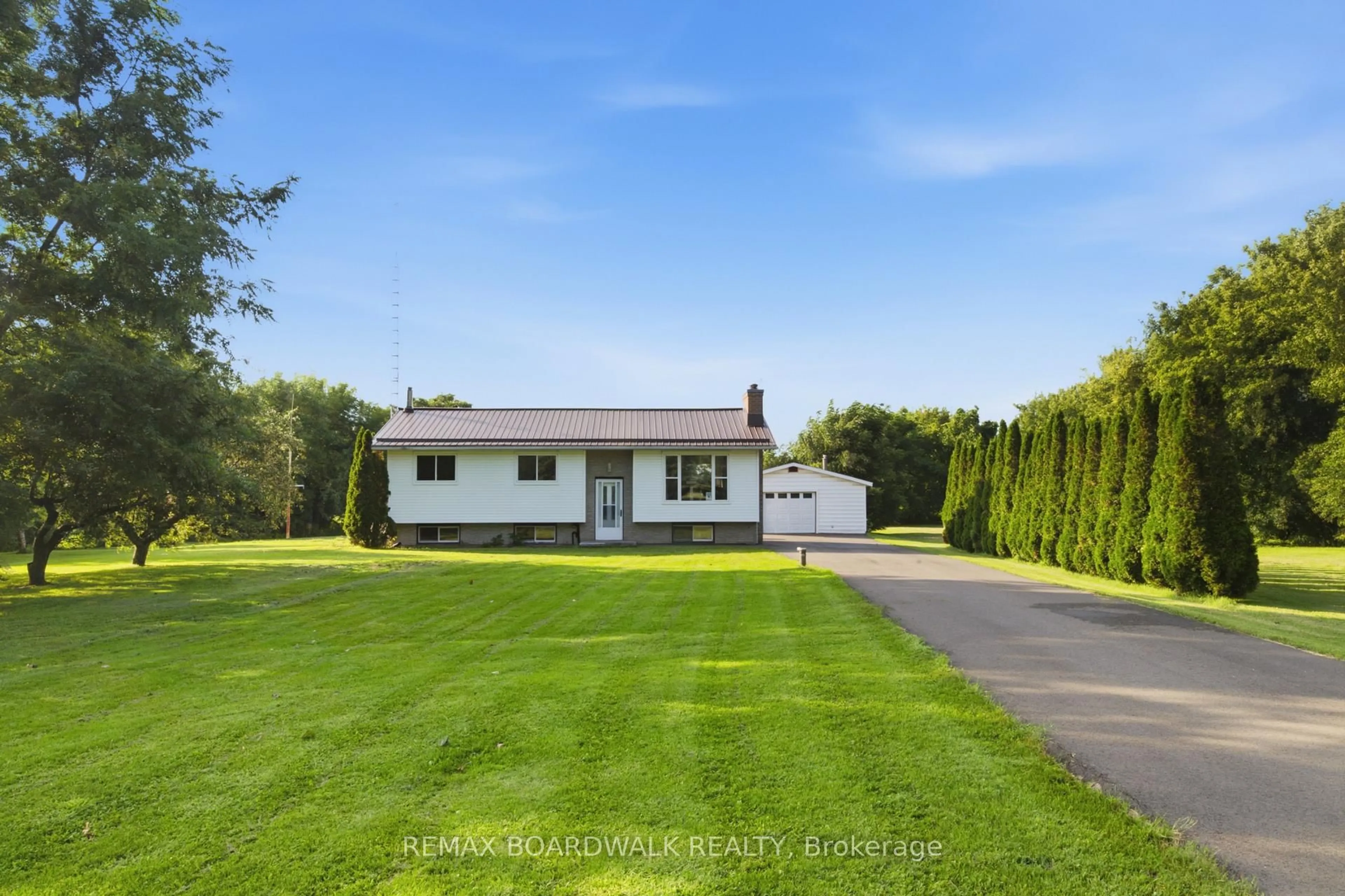 A pic from outside/outdoor area/front of a property/back of a property/a pic from drone, street for 2106 County Road 2 Rd, Edwardsburgh/Cardinal Ontario K0E 1T1