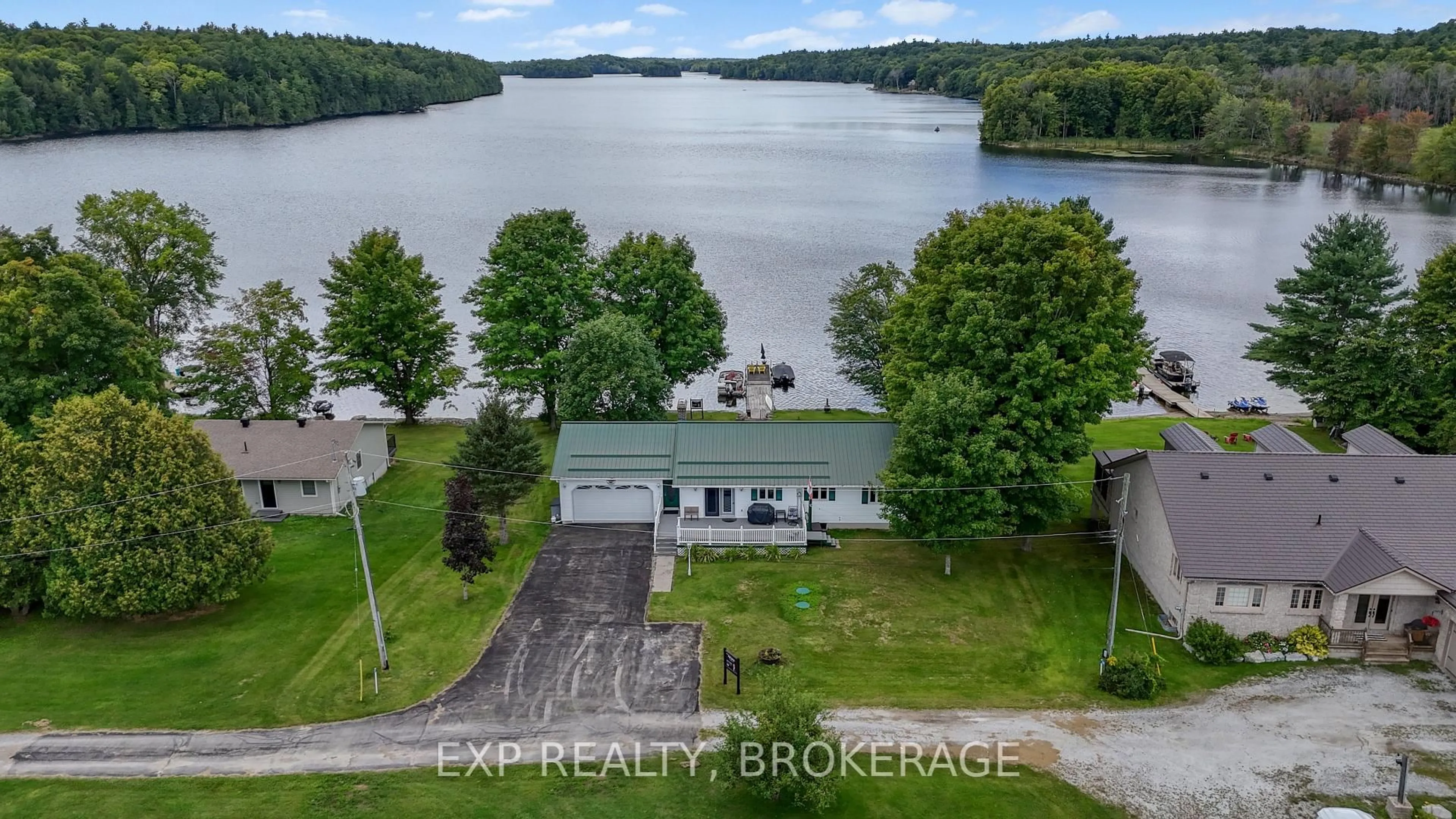 A pic from outside/outdoor area/front of a property/back of a property/a pic from drone, water/lake/river/ocean view for 179 BOBS LAKE LANE 11, Maberly Ontario K0H 2B0
