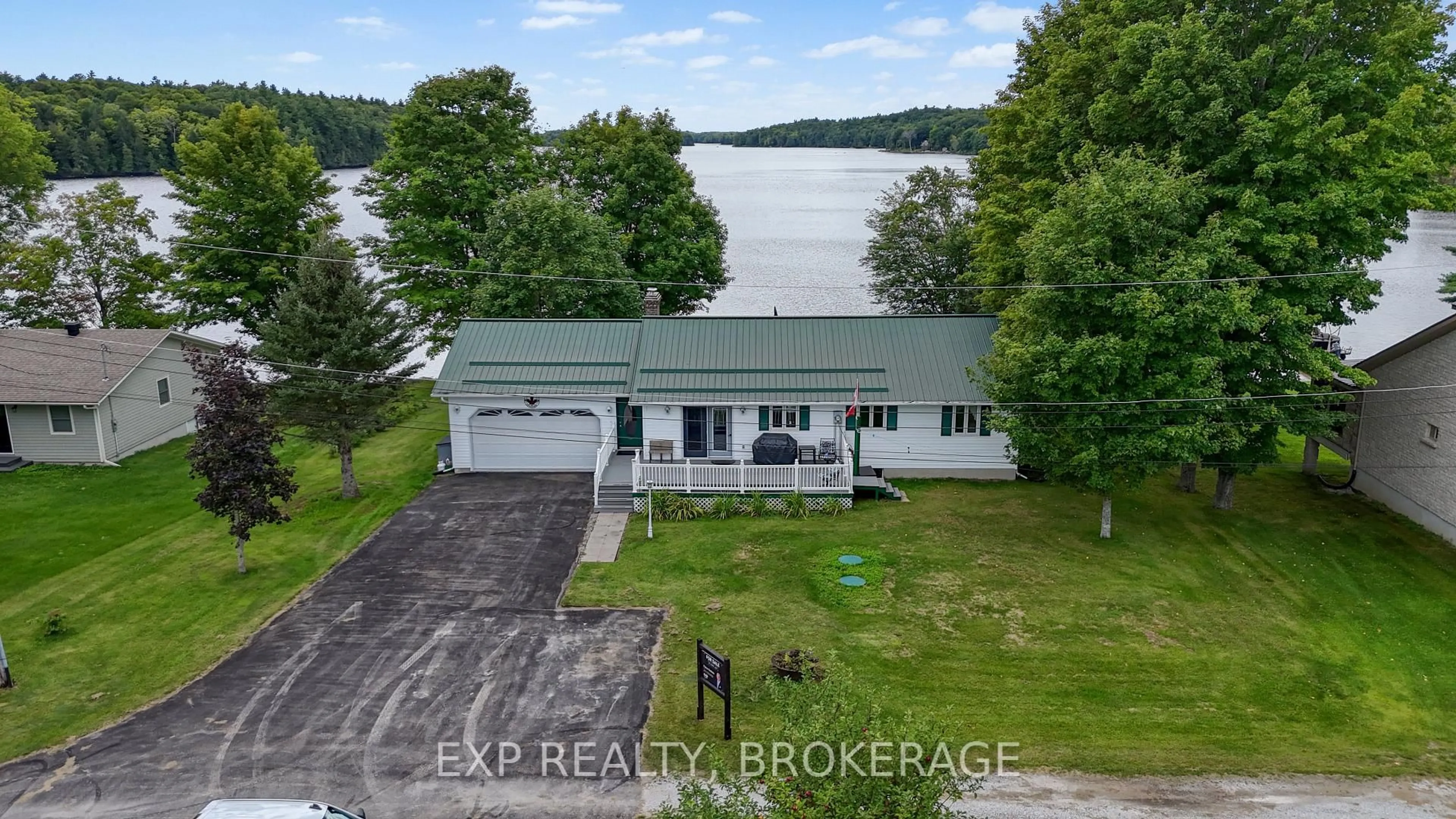 A pic from outside/outdoor area/front of a property/back of a property/a pic from drone, water/lake/river/ocean view for 179 BOBS LAKE LANE 11, Maberly Ontario K0H 2B0