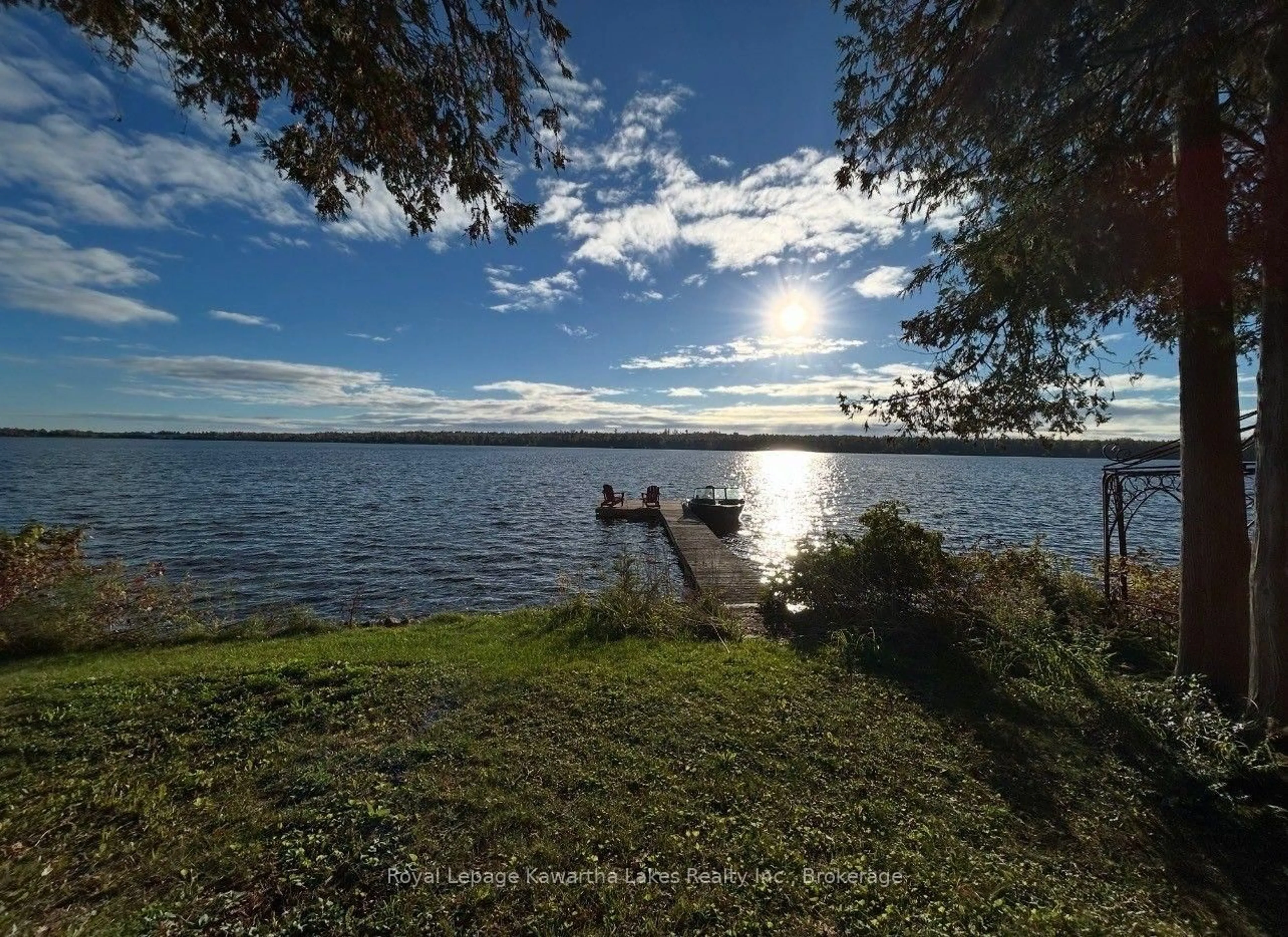 A pic from outside/outdoor area/front of a property/back of a property/a pic from drone, water/lake/river/ocean view for 100 Pinewood Blvd, Kawartha Lakes Ontario K0M 2T0