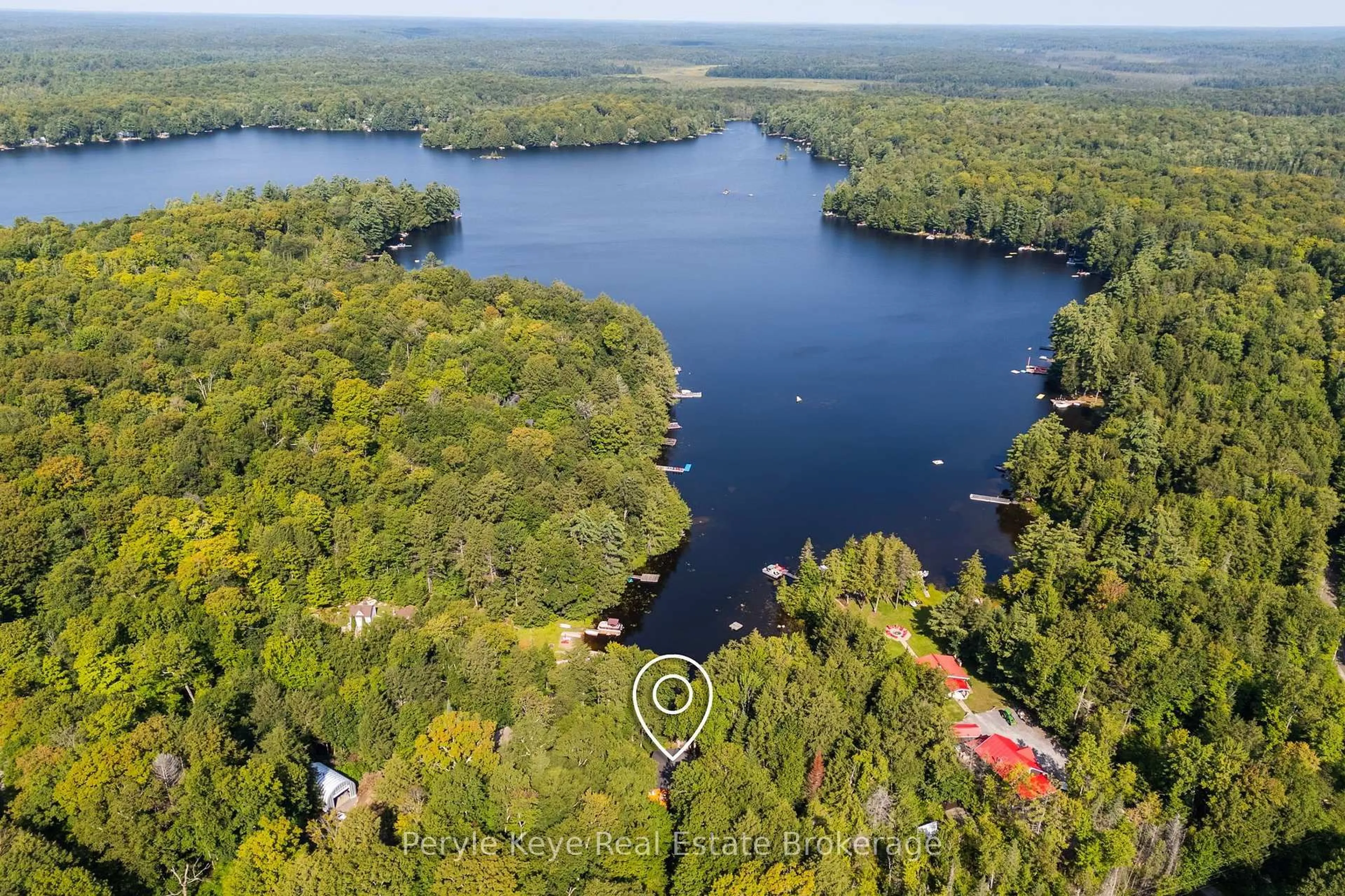 A pic from outside/outdoor area/front of a property/back of a property/a pic from drone, water/lake/river/ocean view for 1160 Lakeshore Dr, Bracebridge Ontario P1L 1X3
