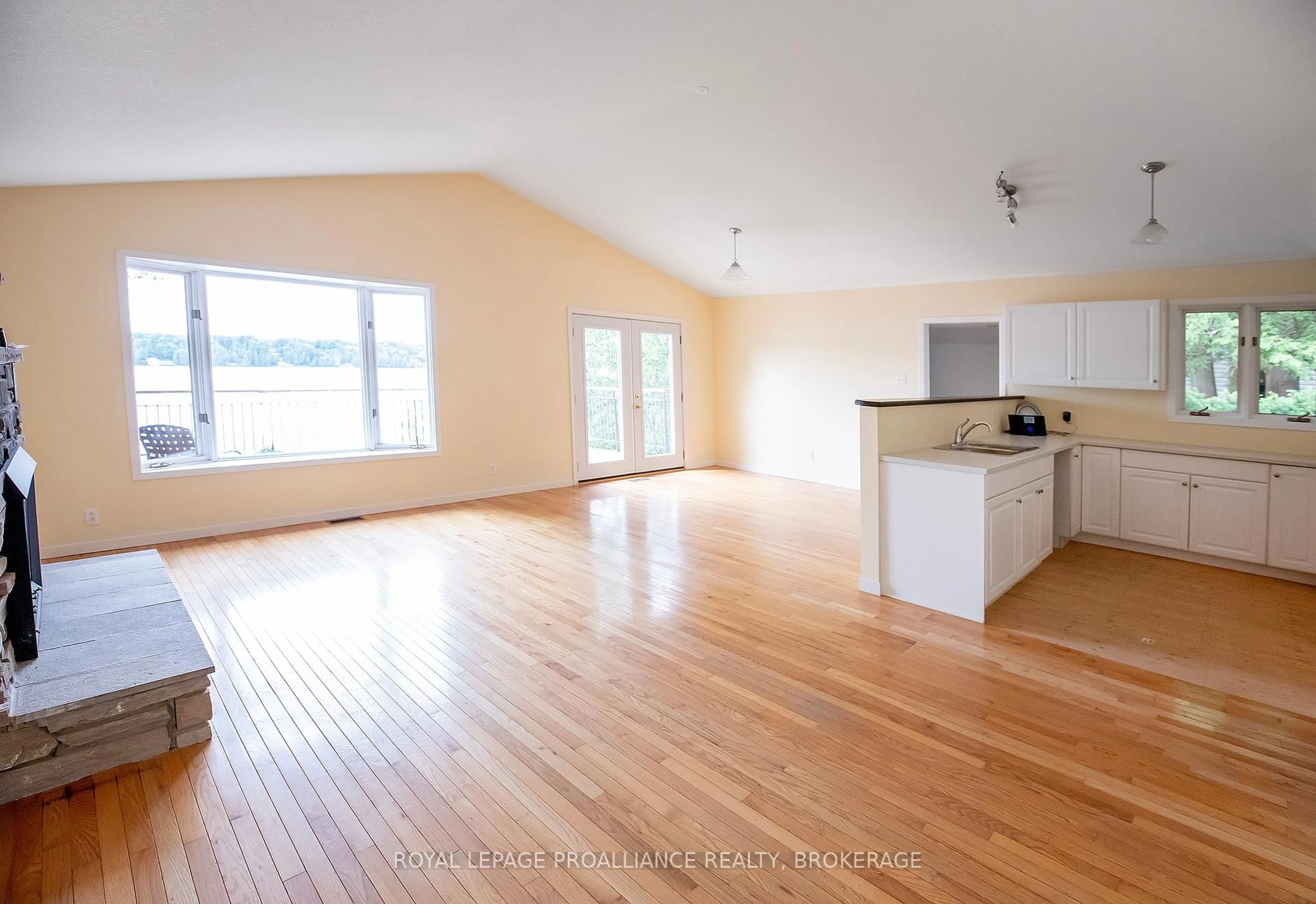 Open concept kitchen, wood/laminate floor for 4502 Red Maple Lane, Inverary Ontario K0H 1X0
