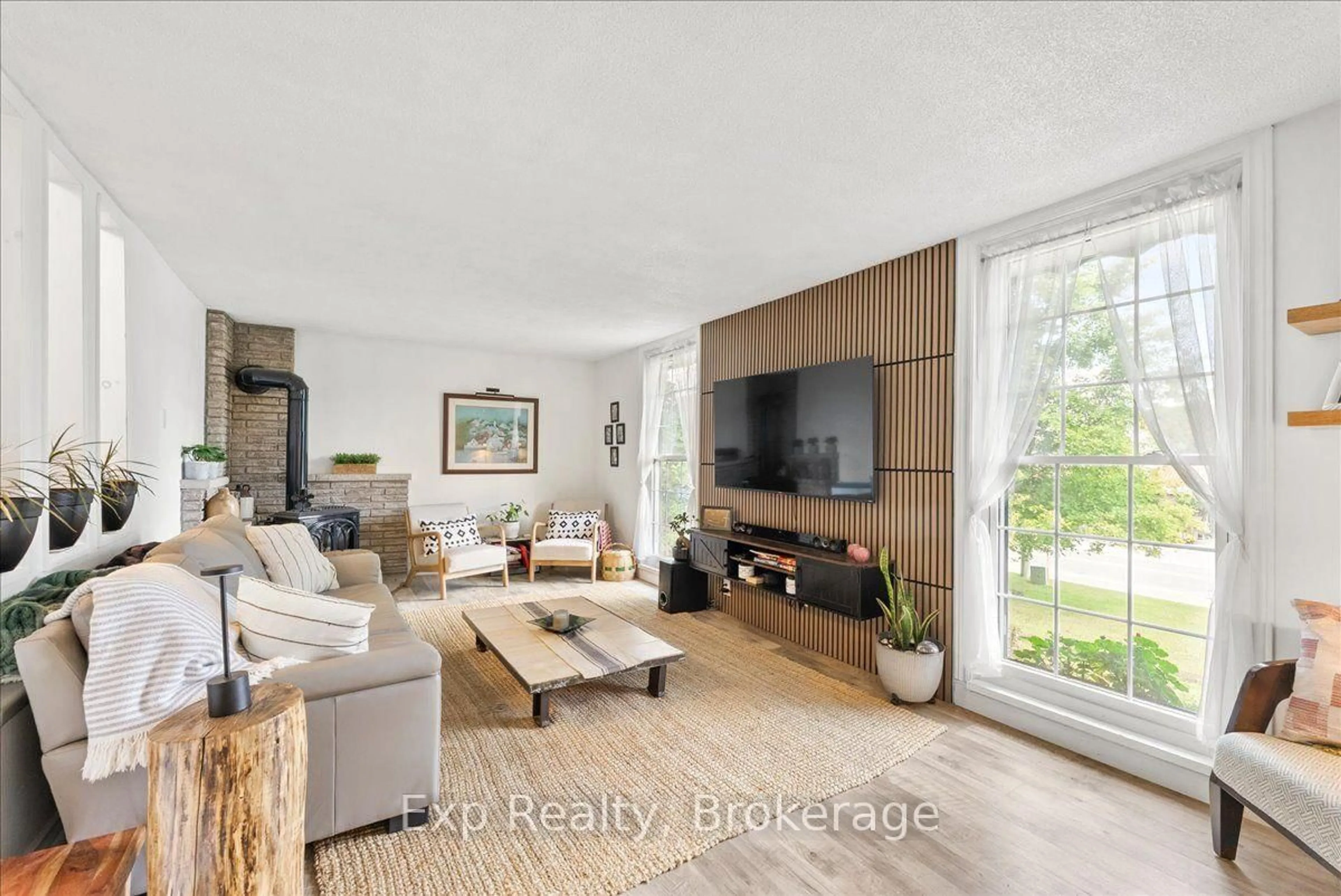 Living room with furniture, wood/laminate floor for 26 Sherbourne St, Bancroft Ontario K0L 1C0