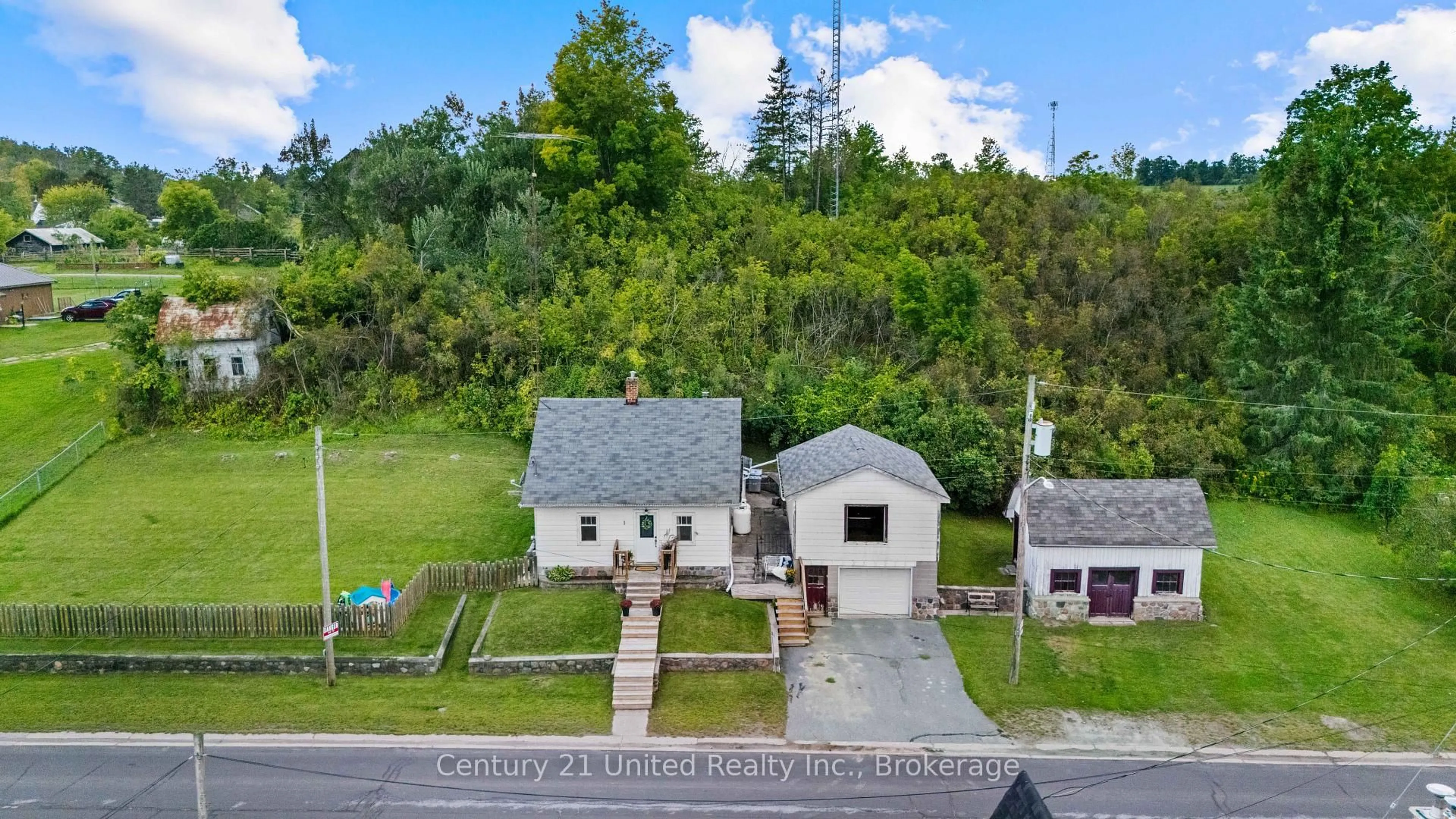 A pic from outside/outdoor area/front of a property/back of a property/a pic from drone, street for 882 Peterborough St, Douro-Dummer Ontario K0L 3A0