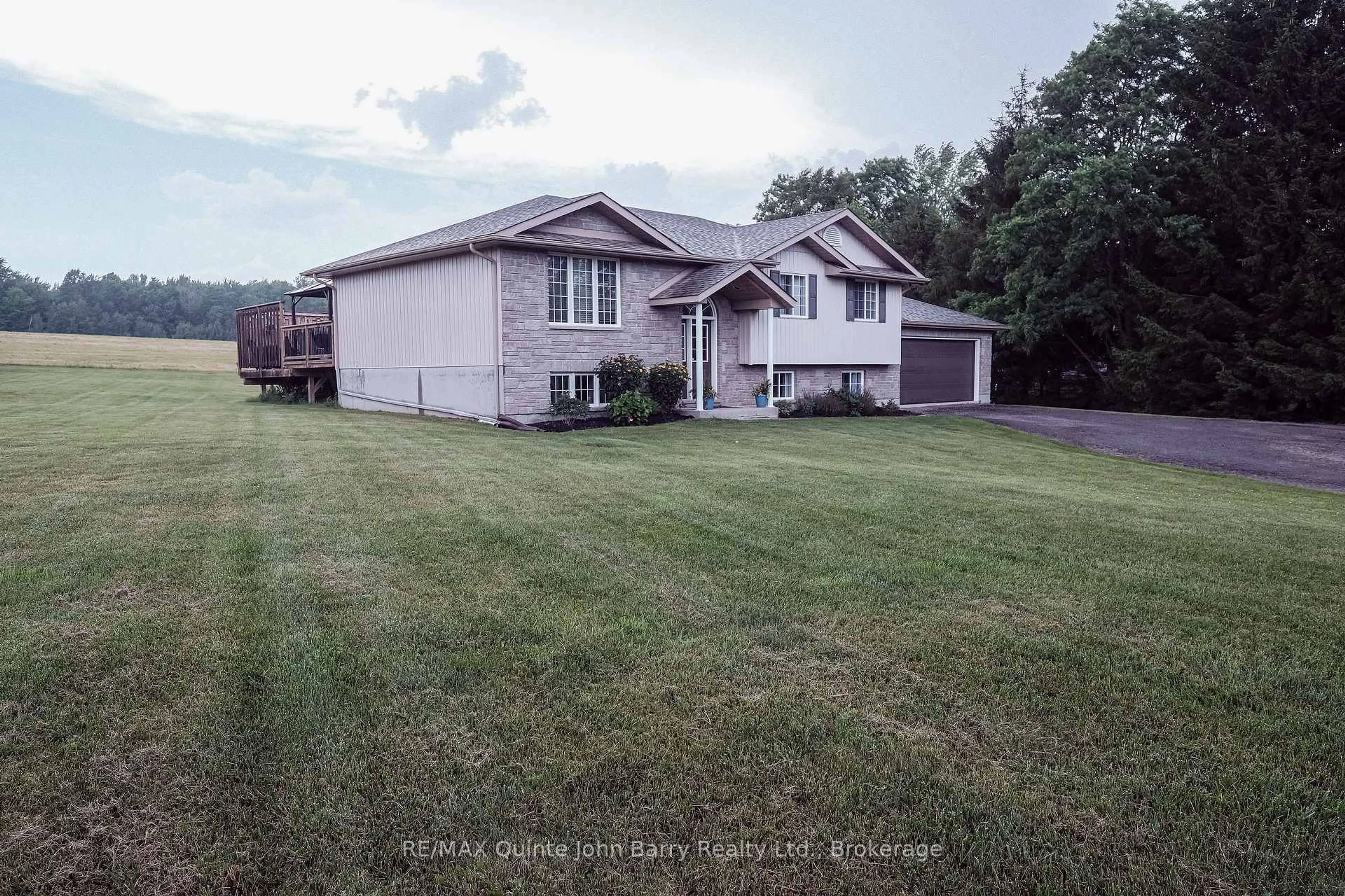 A pic from outside/outdoor area/front of a property/back of a property/a pic from drone, street for 16566 Highway 2, Trenton Ontario K8V 5P7