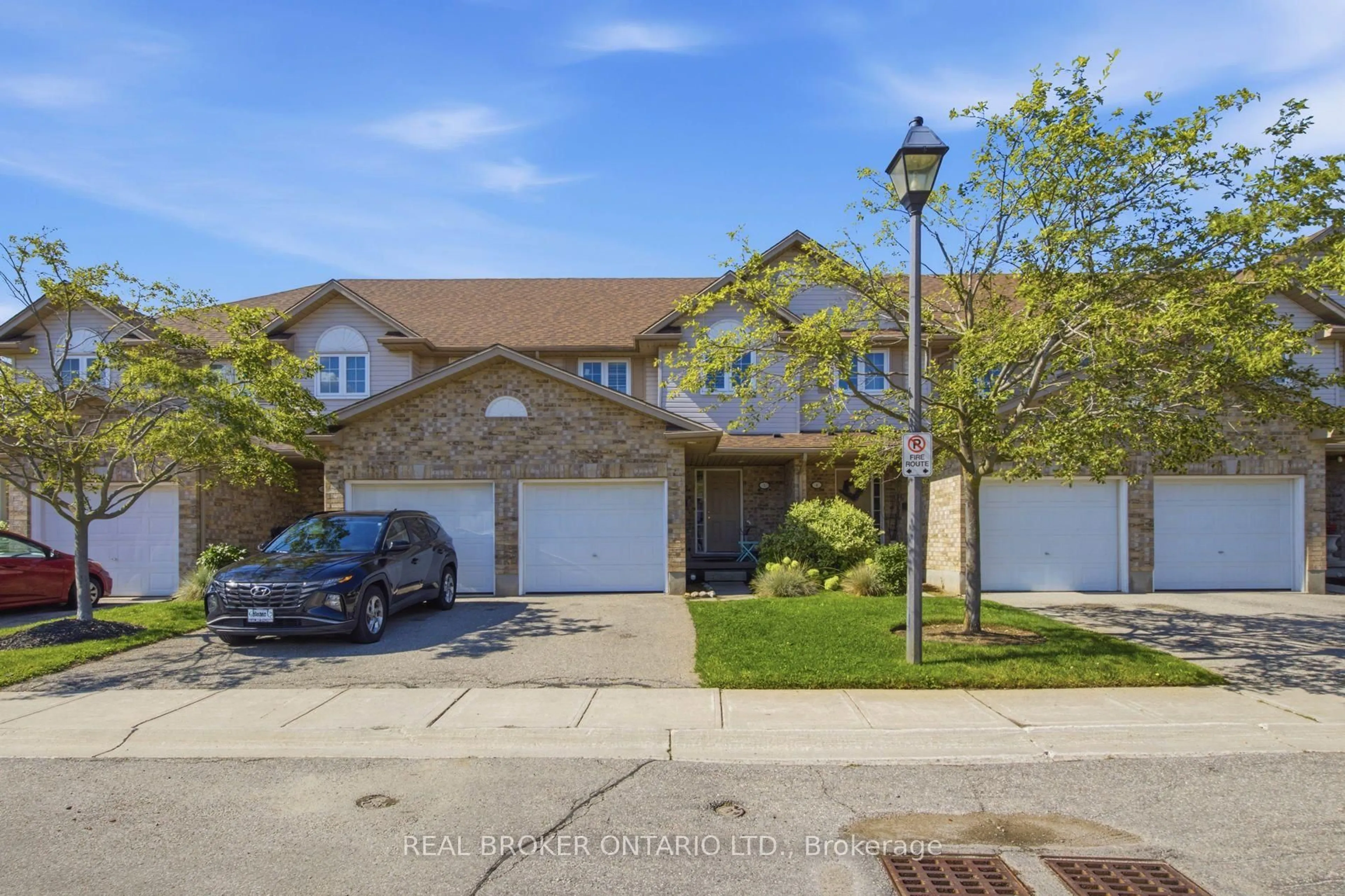 A pic from outside/outdoor area/front of a property/back of a property/a pic from drone, street for 31 Schroder Cres #5, Guelph Ontario N1E 7M6