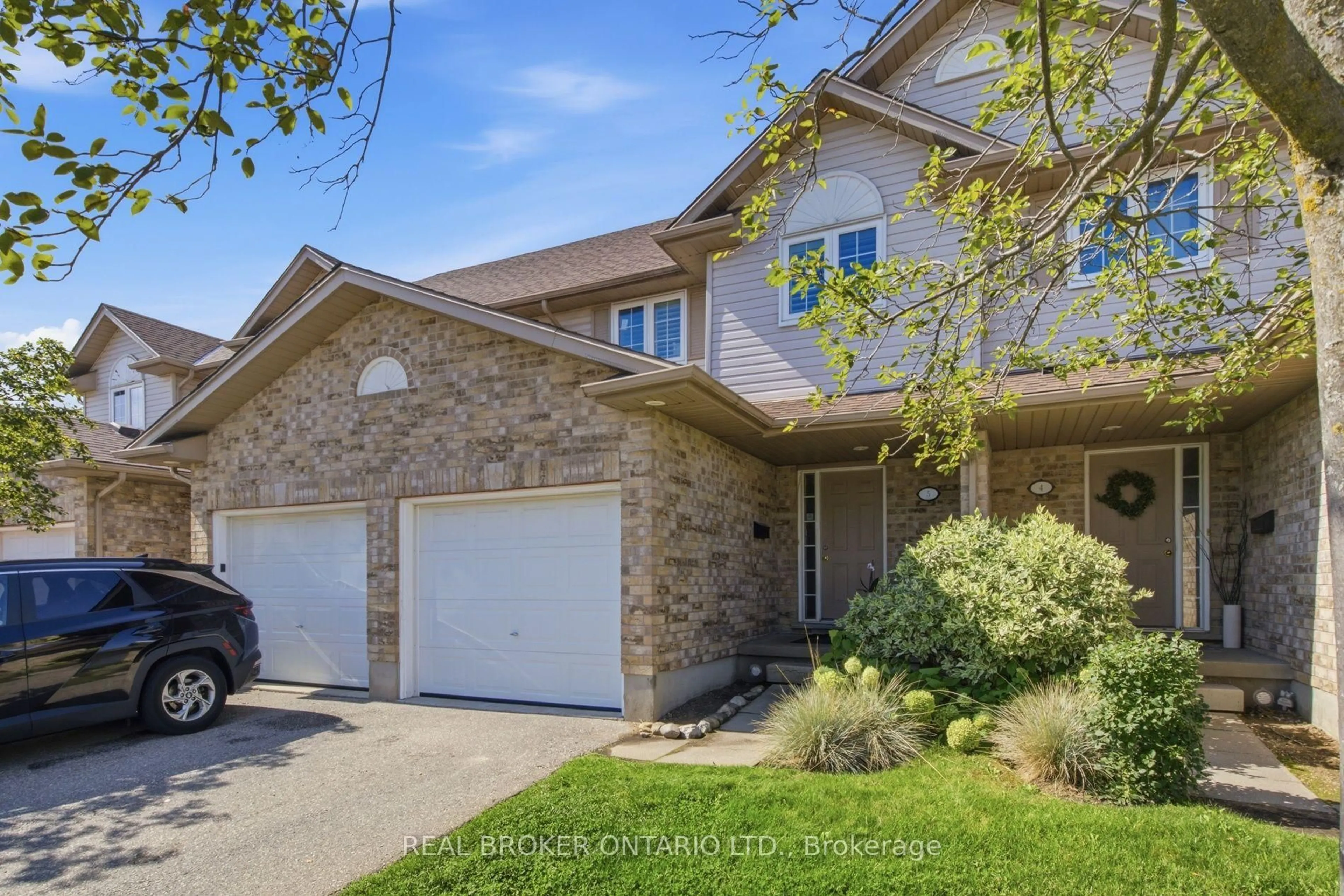 Home with brick exterior material, street for 31 Schroder Cres #5, Guelph Ontario N1E 7M6