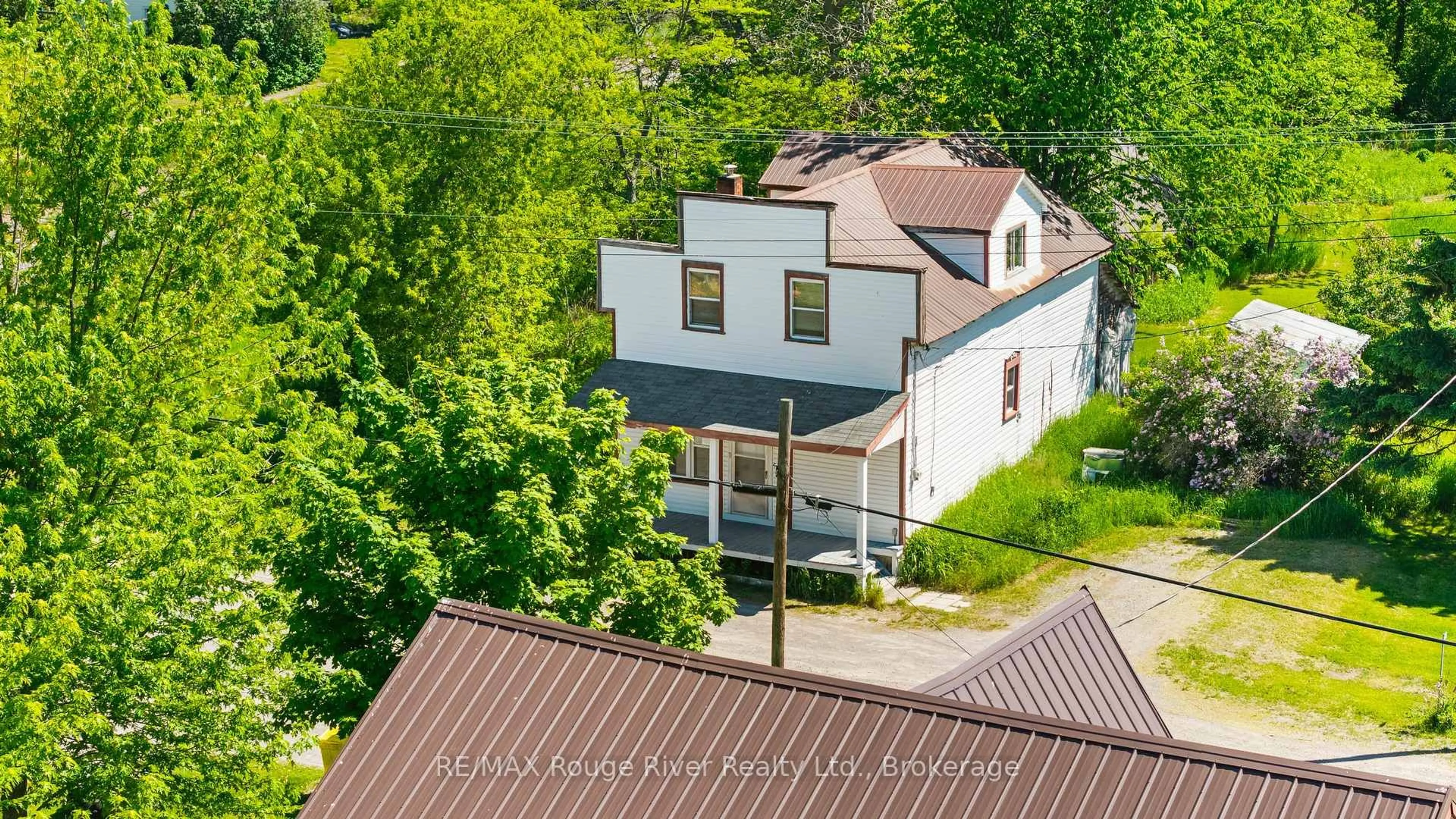 A pic from outside/outdoor area/front of a property/back of a property/a pic from drone, street for 2407 Indian River Line, Otonabee-South Monaghan Ontario K0L 2B0