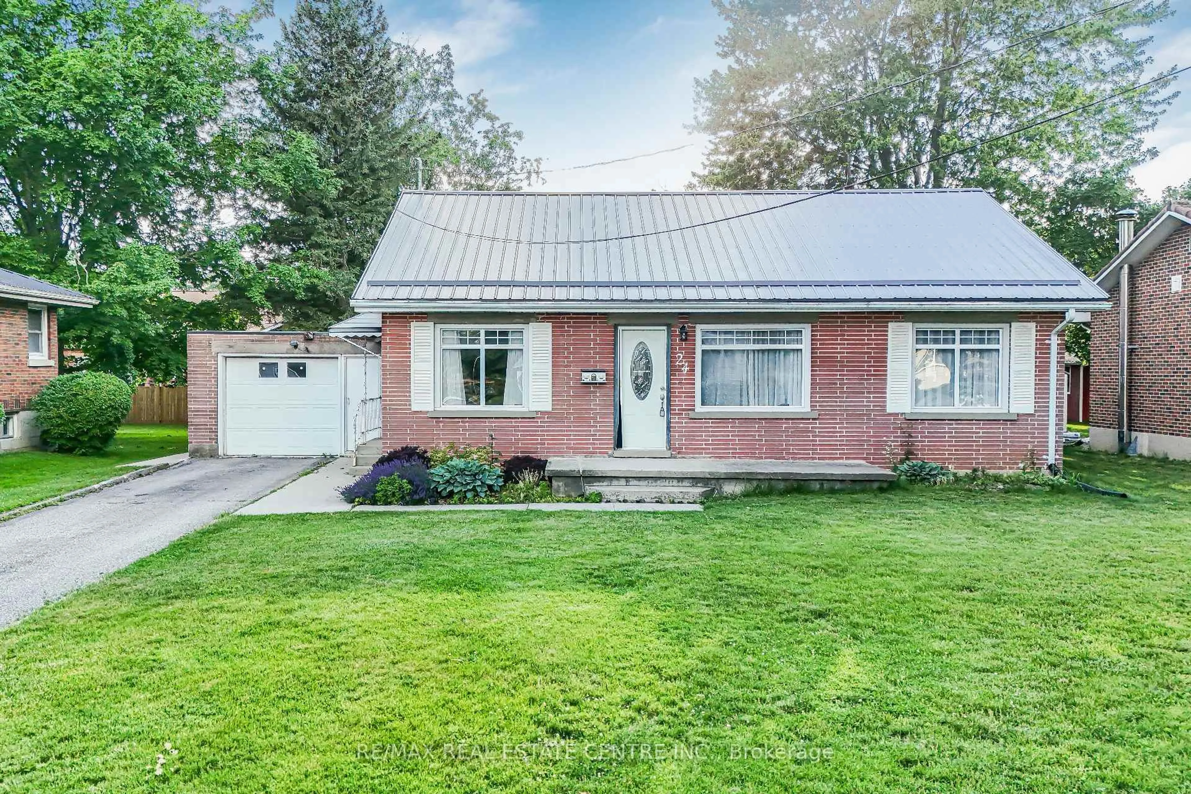 Home with brick exterior material, street for 24 Park St, Aylmer Ontario N5H 2P3