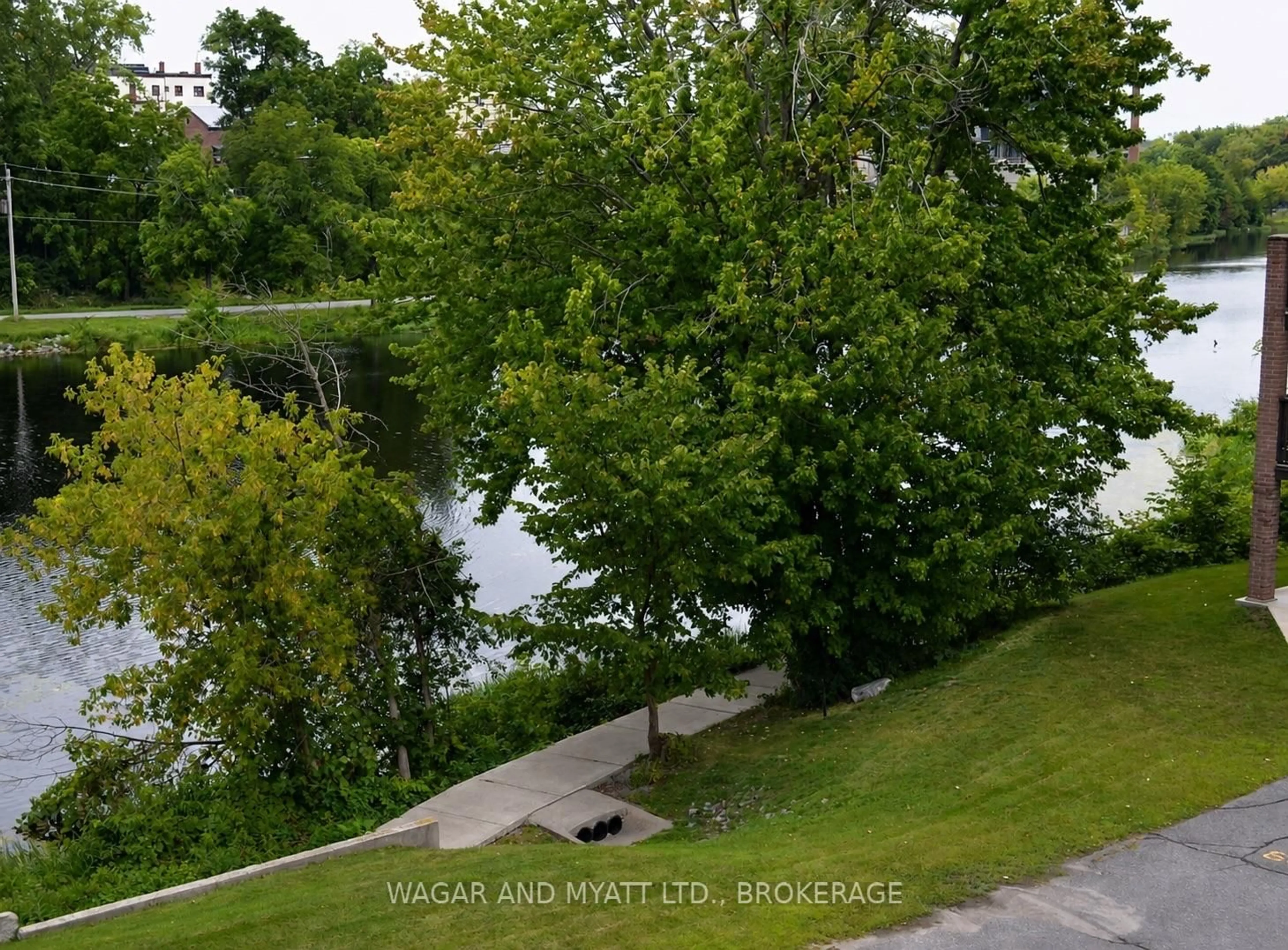 A pic from outside/outdoor area/front of a property/back of a property/a pic from drone, water/lake/river/ocean view for 9 Centre St #305, Greater Napanee Ontario K7R 3X3
