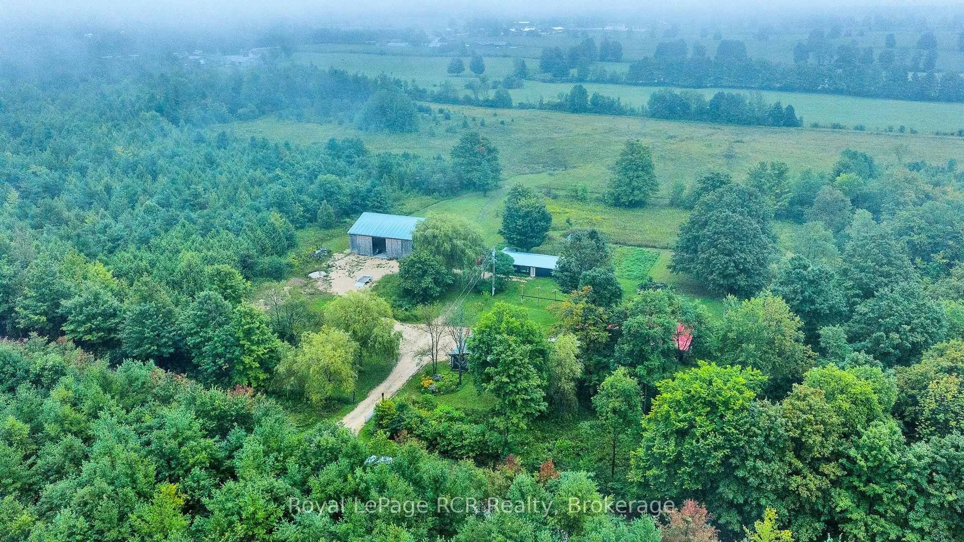 A pic from outside/outdoor area/front of a property/back of a property/a pic from drone, forest/trees view for 585216 Sideroad 10A, Grey Highlands Ontario N0C 1H0