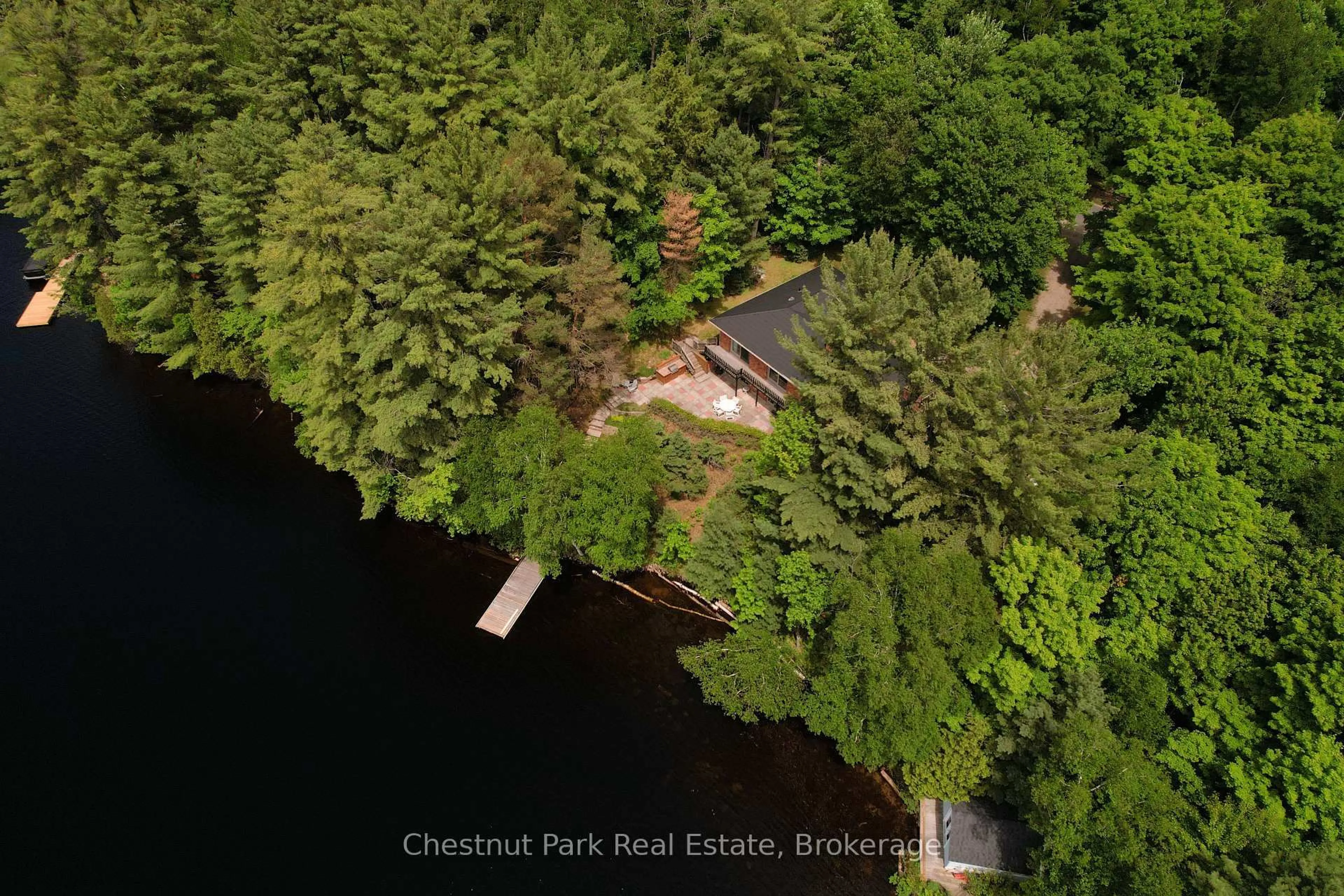 A pic from outside/outdoor area/front of a property/back of a property/a pic from drone, water/lake/river/ocean view for 652 North Waseosa Lake Rd, Huntsville Ontario P1H 2J4