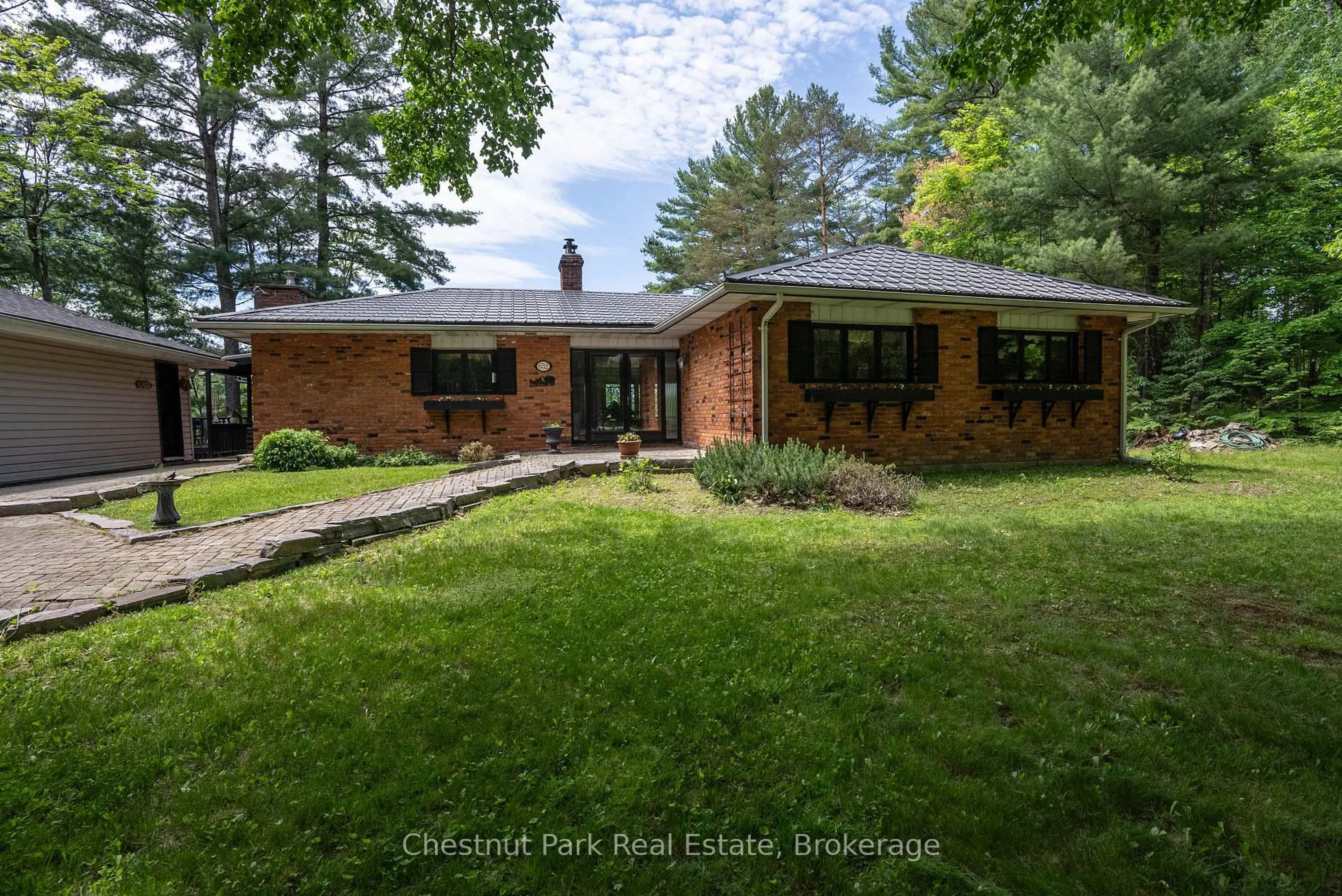 Home with brick exterior material, street for 652 North Waseosa Lake Rd, Huntsville Ontario P1H 2J4