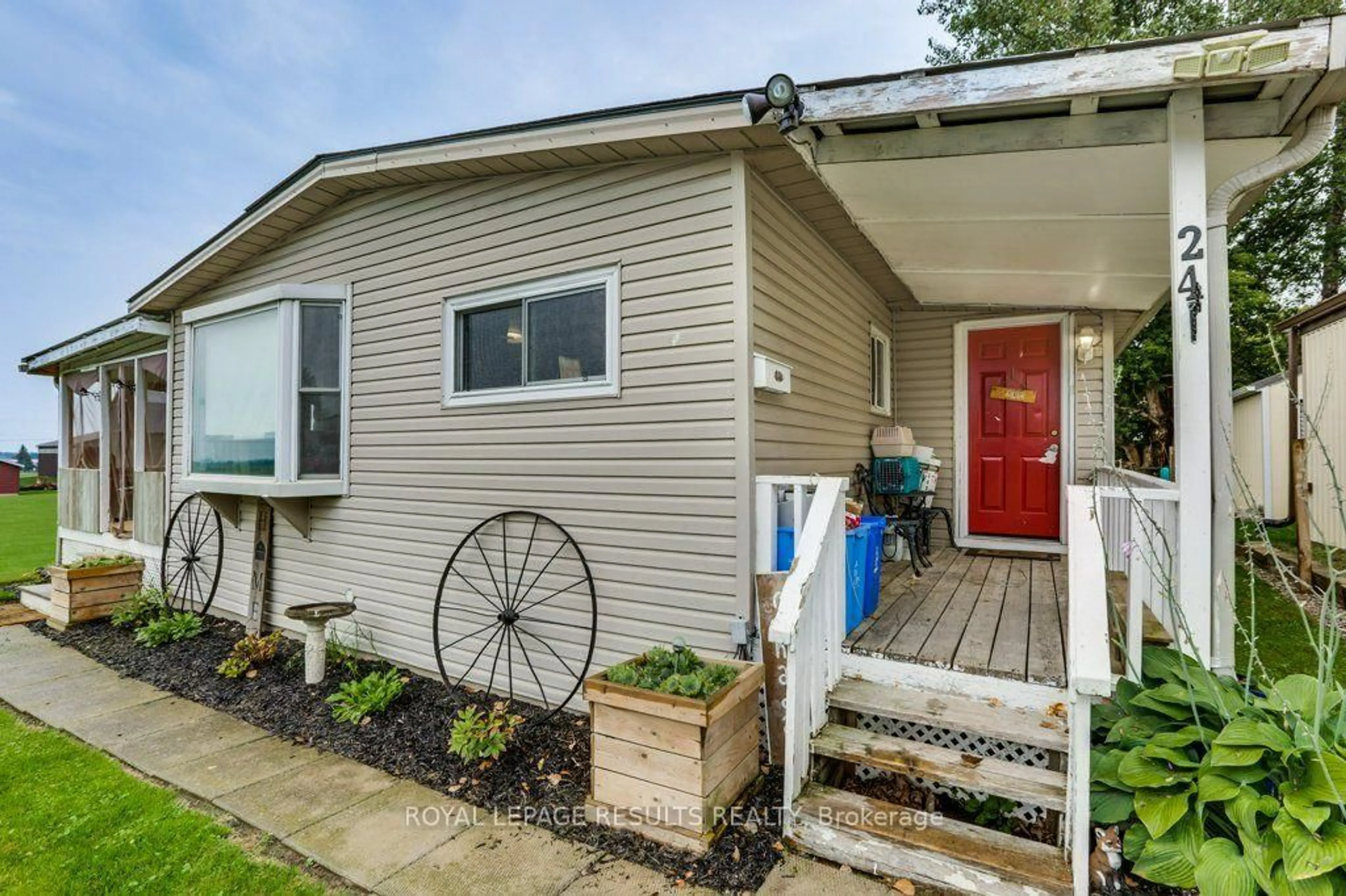 Home with vinyl exterior material, street for 24 Pineview Ave, Malahide Ontario N0L 2J0