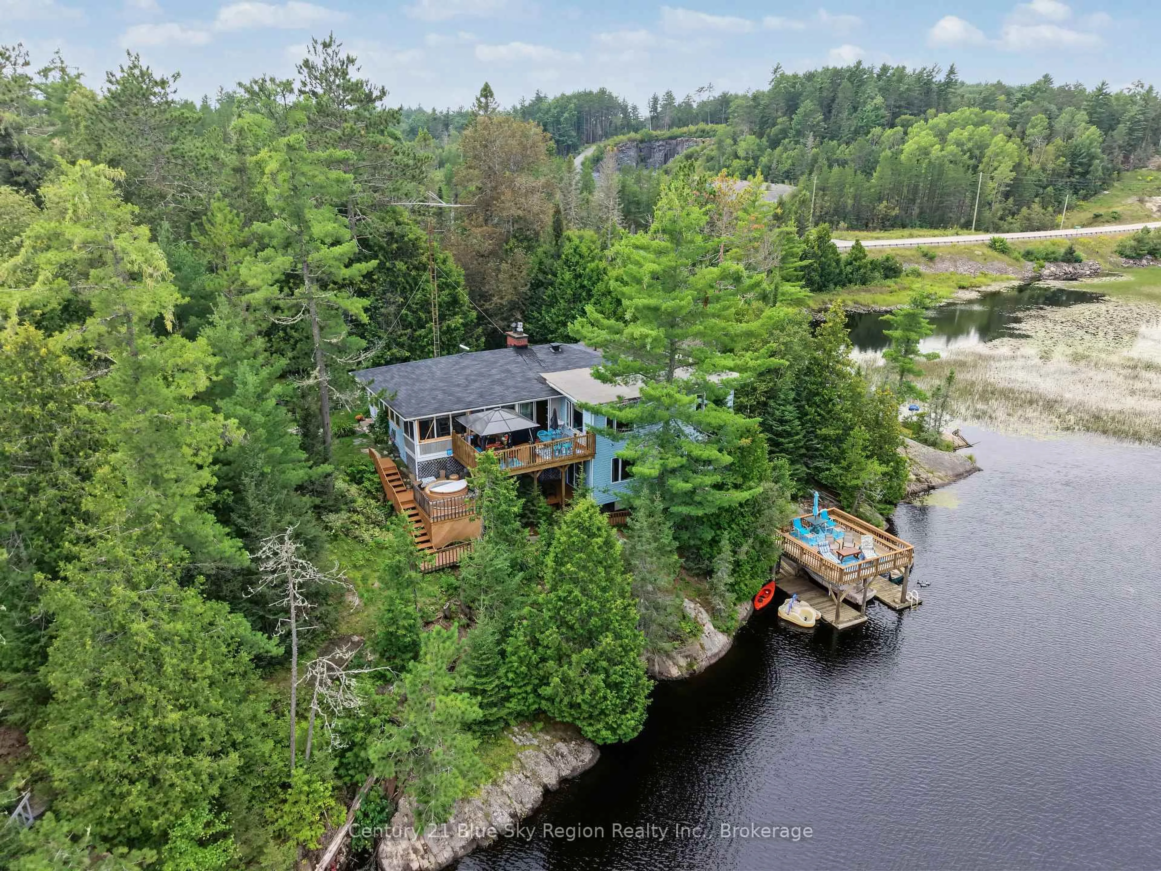 A pic from outside/outdoor area/front of a property/back of a property/a pic from drone, water/lake/river/ocean view for 5065 Highway 11, Temagami Ontario P1B 8G3