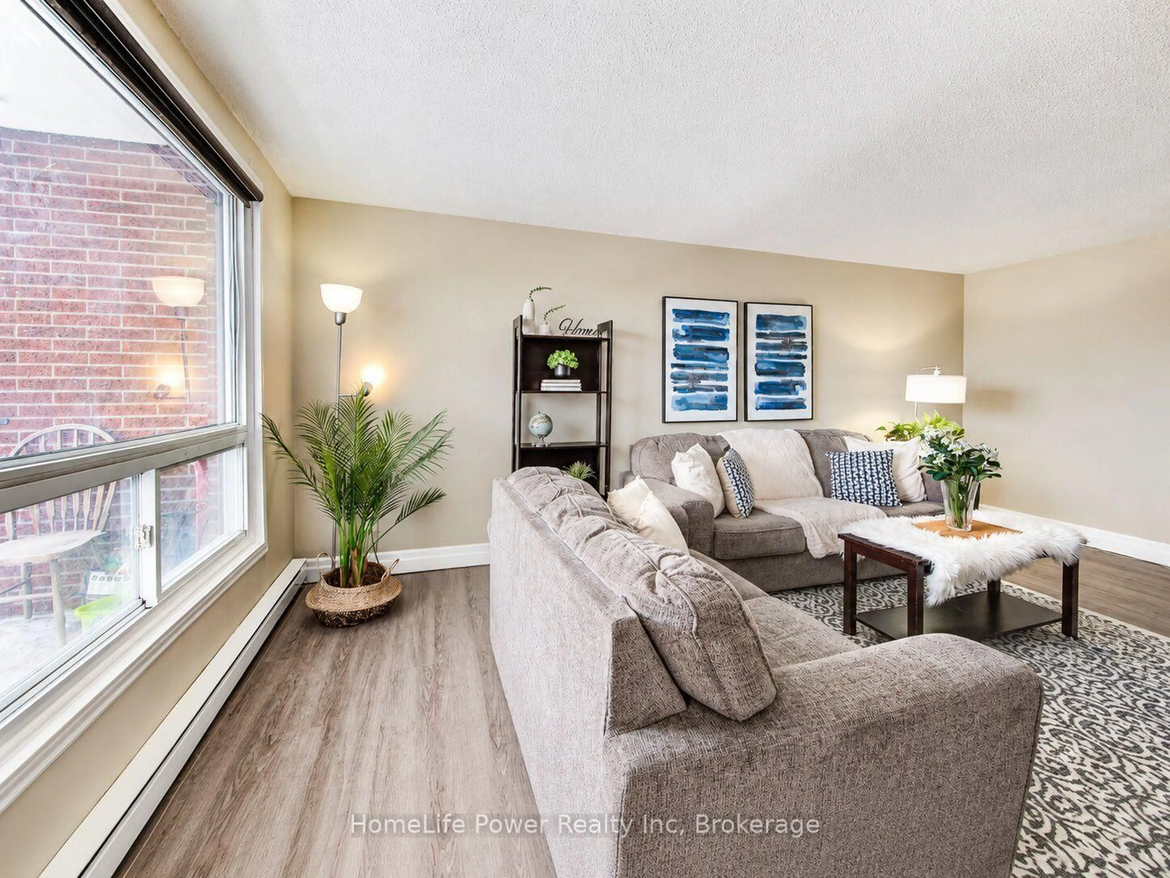 Living room with furniture, wood/laminate floor for 4 Avalon Pl #303, Kitchener Ontario N2M 4N6