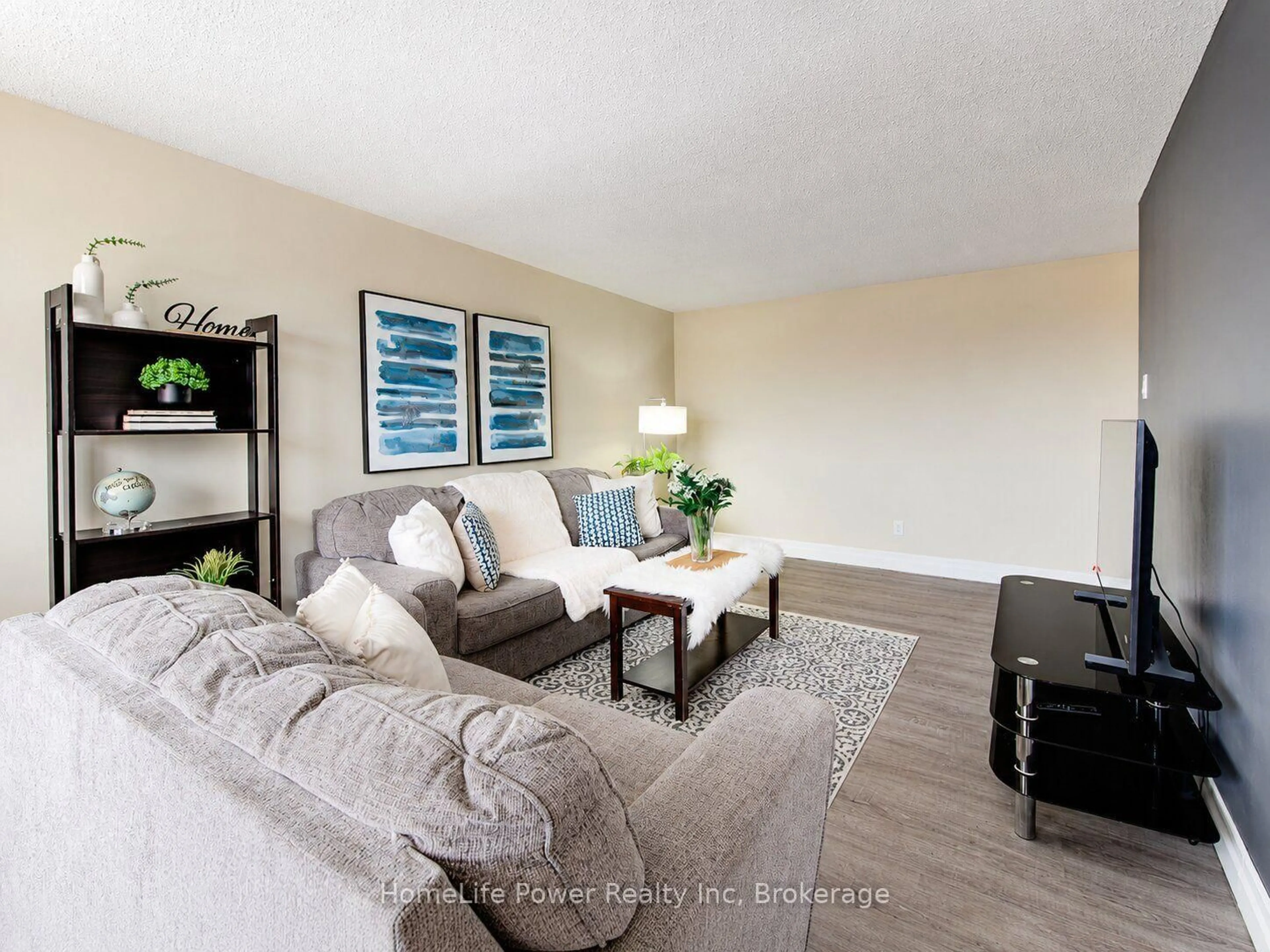 Living room with furniture, wood/laminate floor for 4 Avalon Pl #303, Kitchener Ontario N2M 4N6