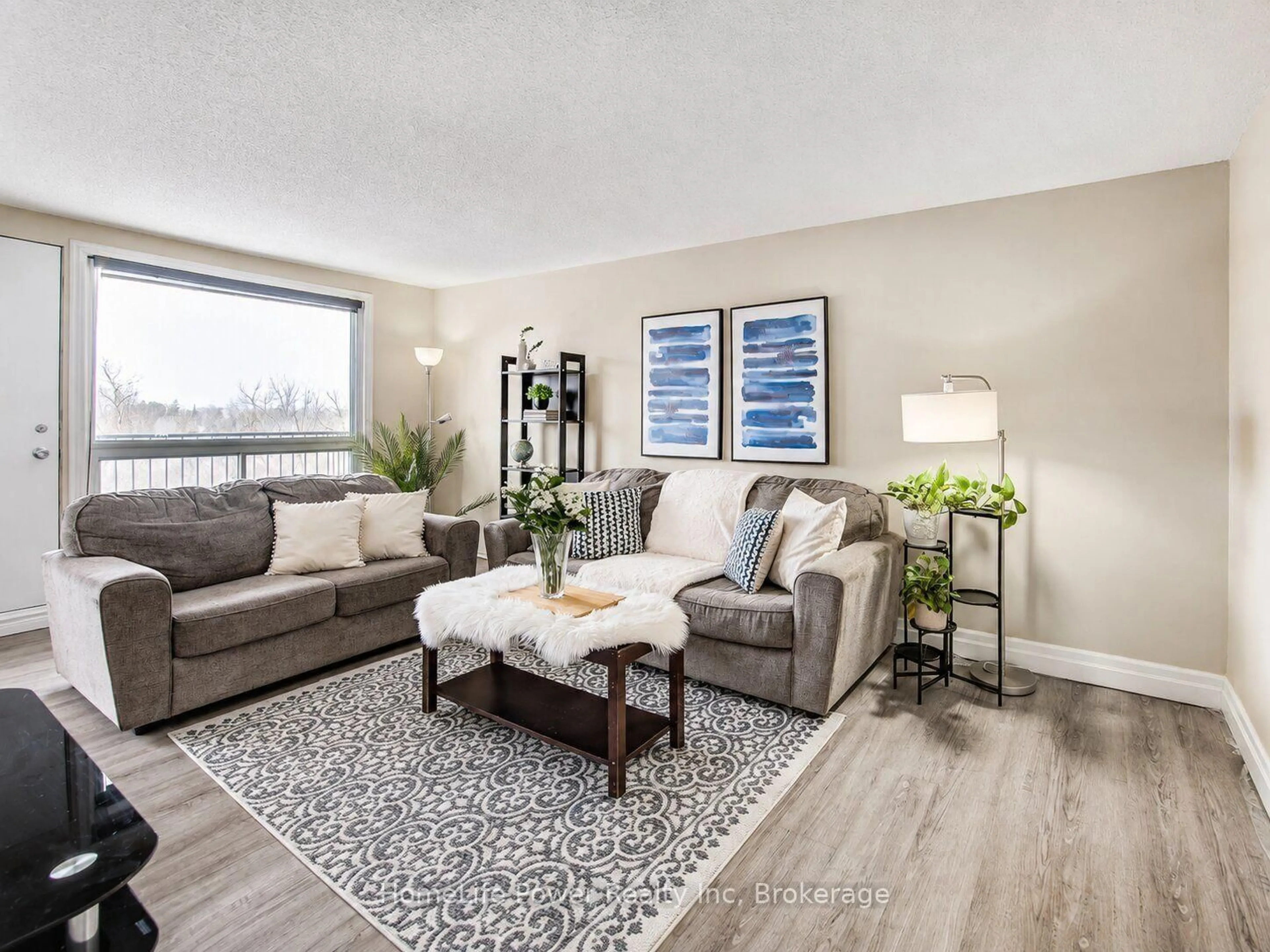 Living room with furniture, wood/laminate floor for 4 Avalon Pl #303, Kitchener Ontario N2M 4N6