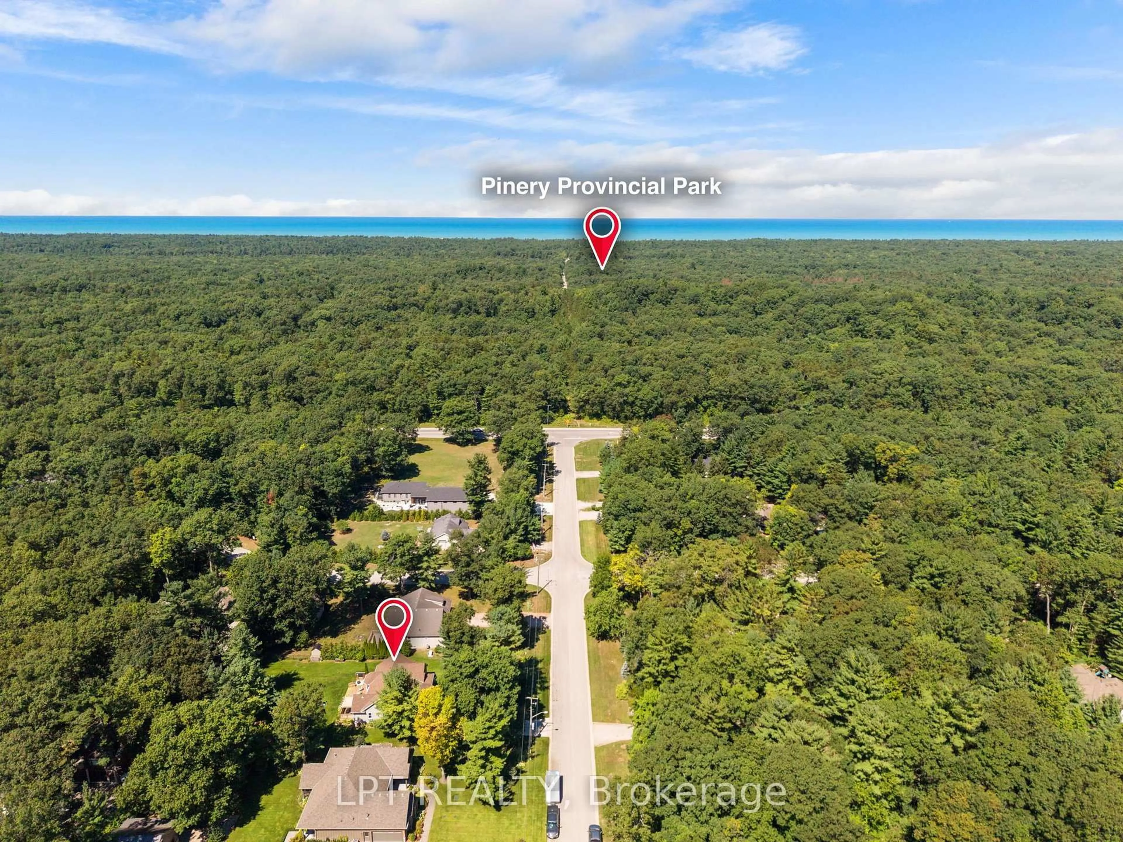 A pic from outside/outdoor area/front of a property/back of a property/a pic from drone, forest/trees view for 10011 Jenna Rd, Lambton Shores Ontario N0M 1T0