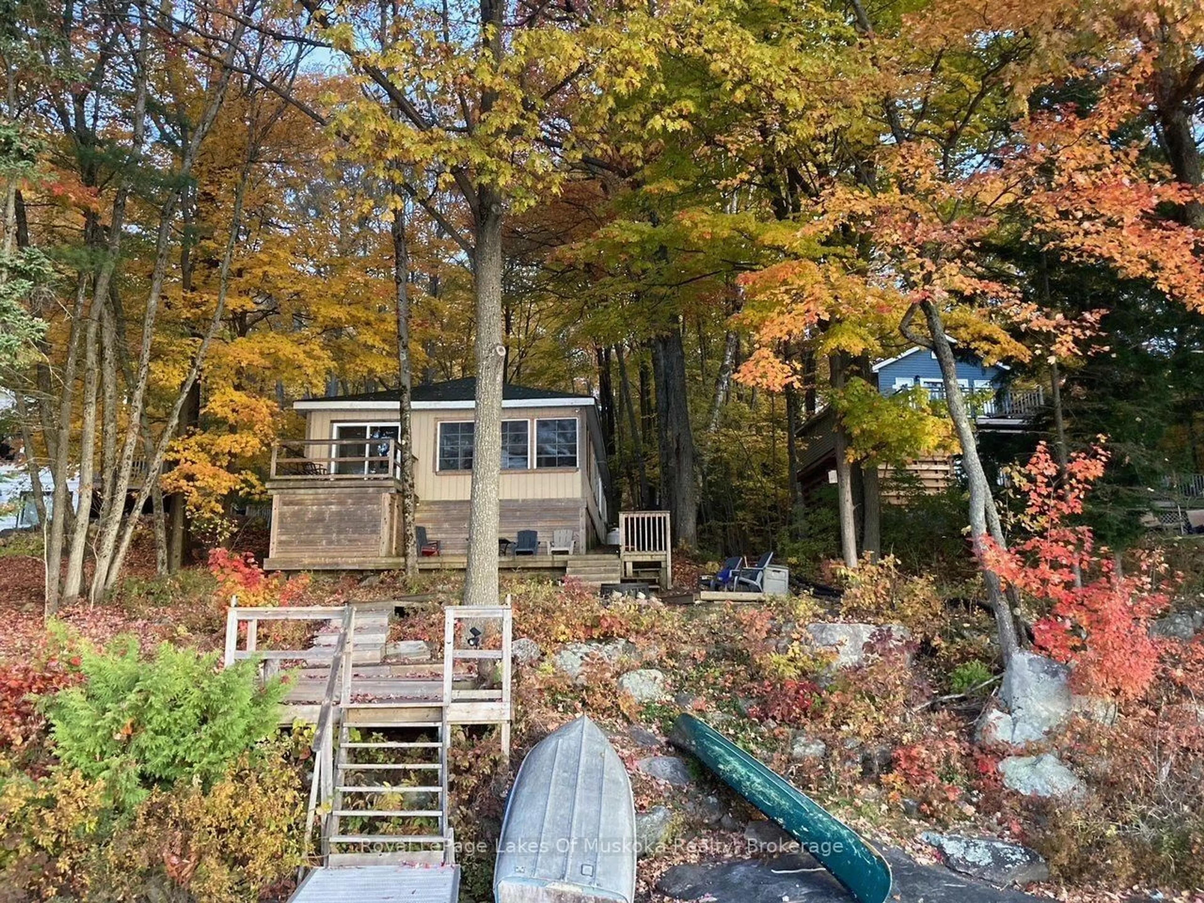 A pic from outside/outdoor area/front of a property/back of a property/a pic from drone, water/lake/river/ocean view for 1063 Dickie Lake Rd, Lake of Bays Ontario P0B 1A0
